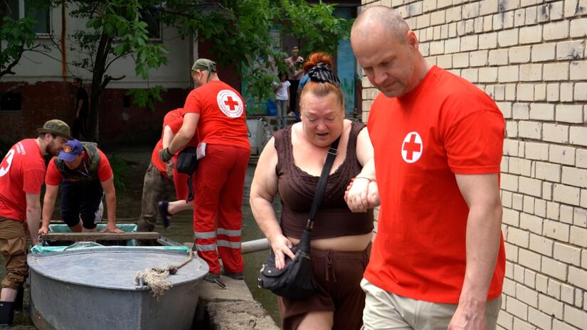 Rapid response teams of the Ukrainian Red Cross Society rescue hundreds of people by boat following the collapse of the Nova Kakhovka Dam in June 2023