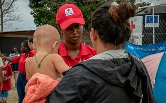 Red Cross volunteer helps with support from PPP