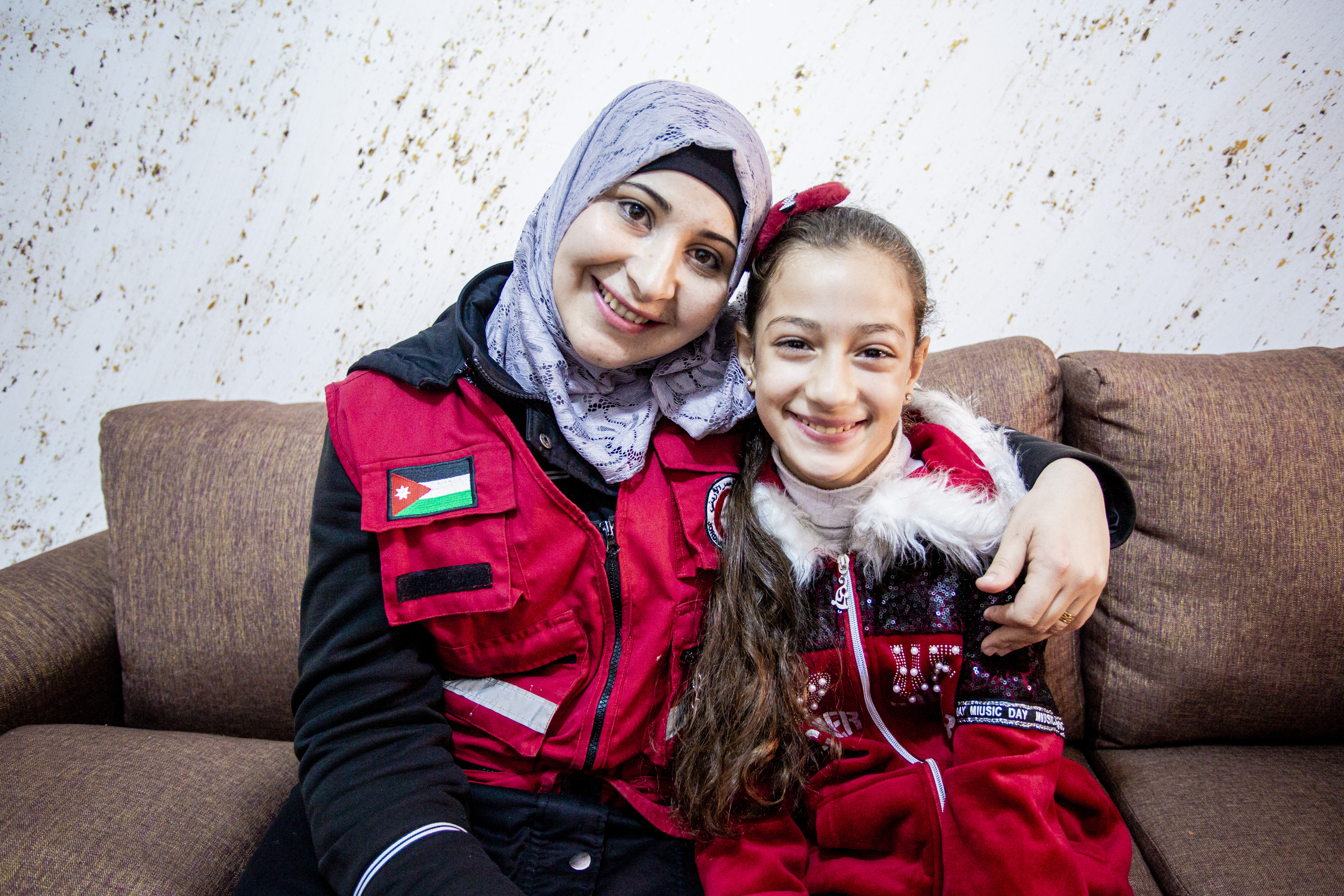 Amman, Jordan, 28 November 2019.Jordan Red Crescent community volunteer Raoa'a Abo Alaban, 24, chatting with 10-year-old Sadel in Amman, Jordan. After Sadel faced bullying and a violent incident at sc