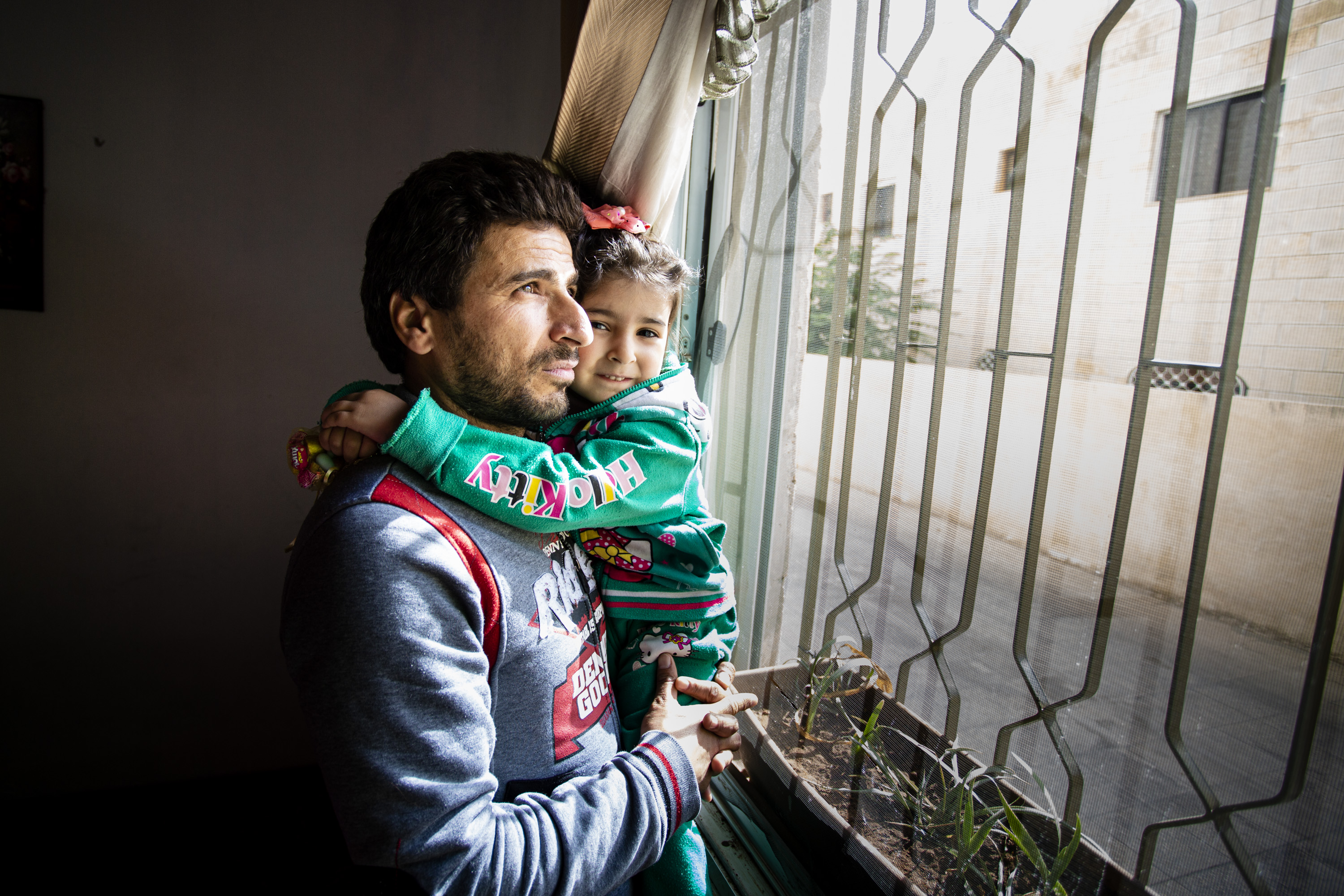 Amman, Jordan, 26 November 2019.Nafe Ahmad Khalifah from Syria, with his daughter Zain, in their home in Amman, Jordan, 26 November 2019. Through the Jordan Red Crescent, supported by the IFRC and fun