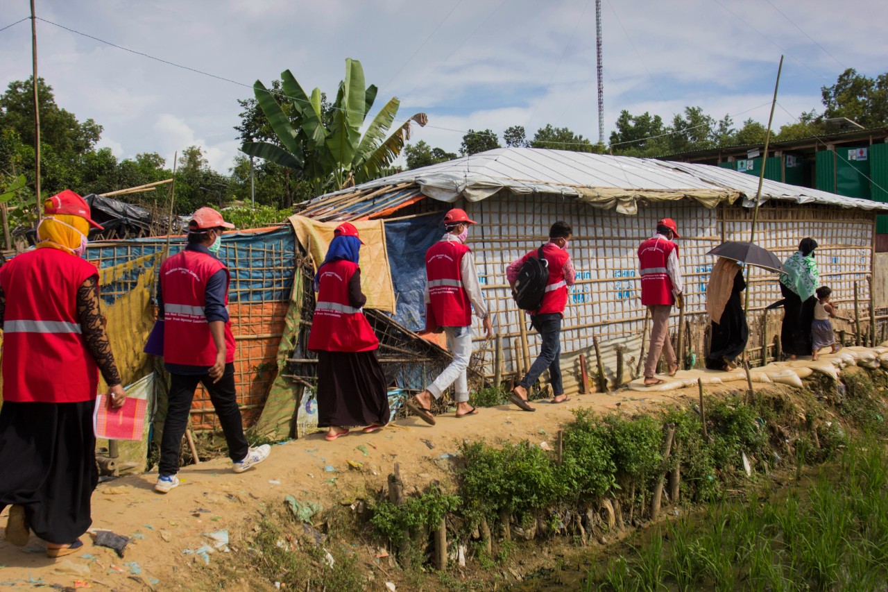 In Cox's Bazar, Bangladesh Red Crescent Society volunteers, with support from the IFRC and partners, conduct door-to-door health visits during the COVID-19 pandemic.