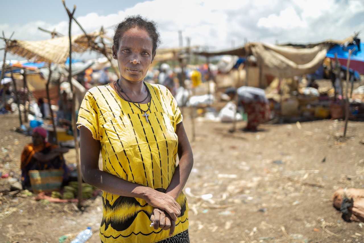 A woman stands for a photo in April 2021 in Arba Minch, Ethiopia - an area affected by conflict, drought, epidemics, food insecurity and pest outbreaks.