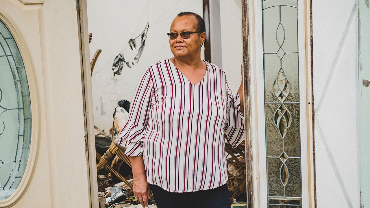 Lovely inspects the damage to her home caused when Hurricane Dorian, a category 5 Atlantic hurricane that smashed through the Bahamas on September 1, 2018.