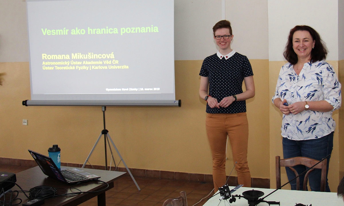 Romy gives a presentation at her old high school alongside her former physics teacher who inspired her to pursue a career as a scientist.