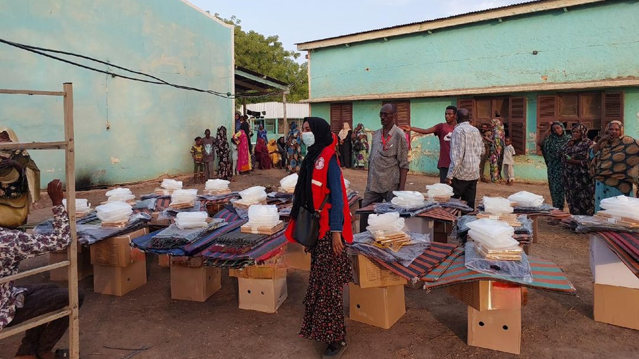 Sudanese Red Crescent volunteers in White Nile state distribute food supplies provided by the World Food Programme to people affected by the ongoing conflict.
