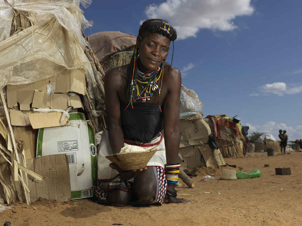 Mwandjukatji from Angola sits in a camp for migrants close to the town of Omusati, near Namibia’s northwestern border with Angola. 