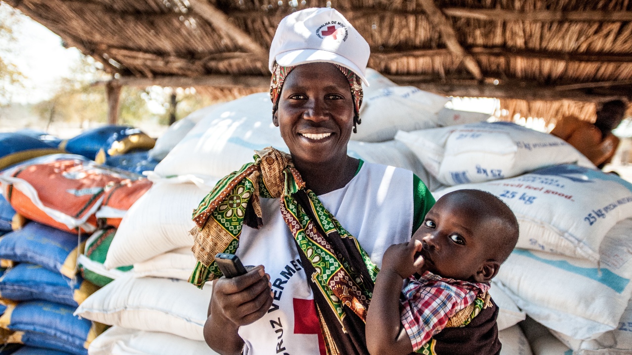 A Red Cross volunteer assists with a food distribution in Mabalane district, Mozambique.