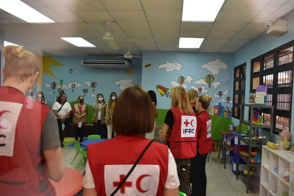 A team from the IFRC meets at the Center of Attention for Migrant Children and Families, located in Belen, Honduras.