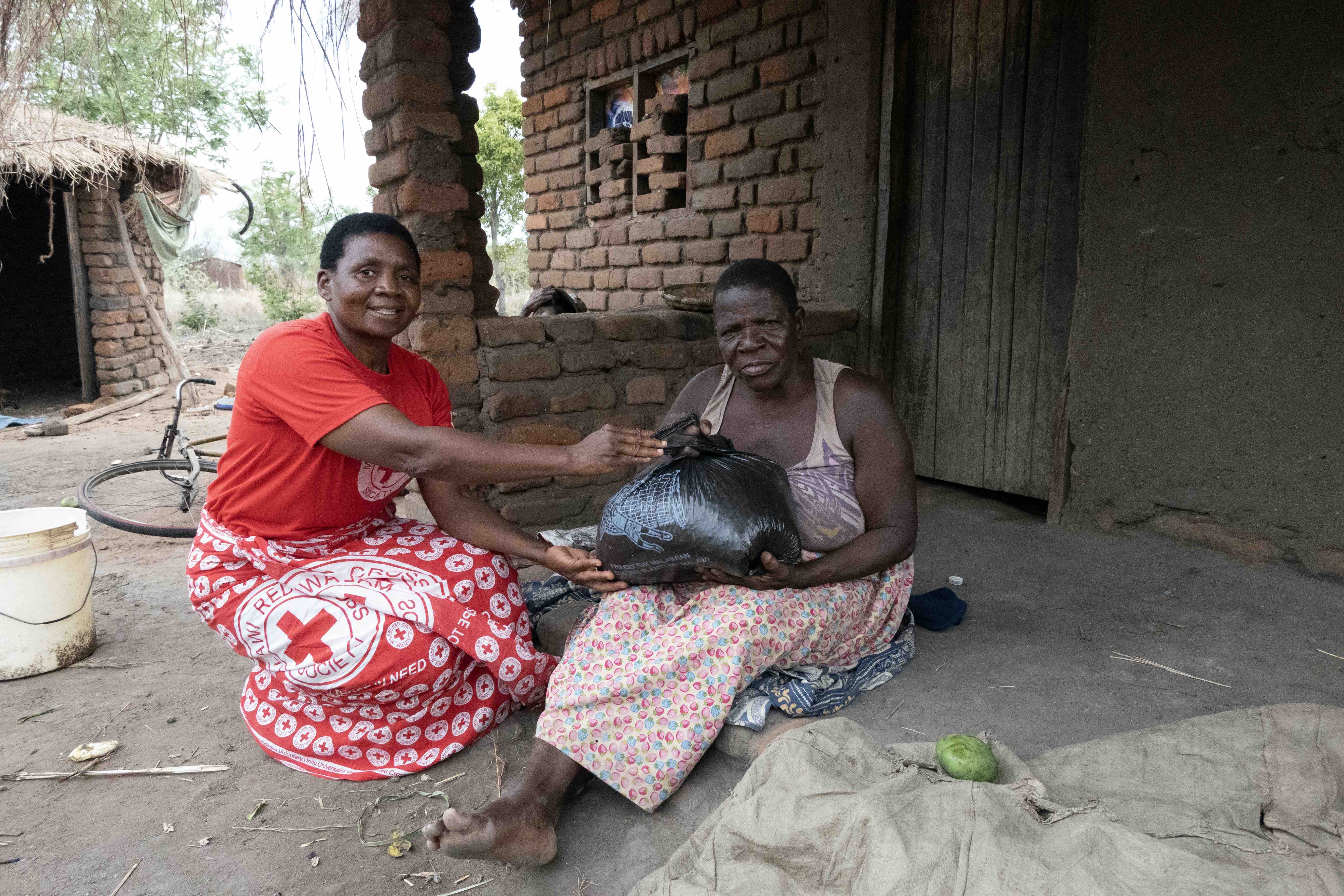 Malawi Red Cross volunteers bring support in various forms: food, cash-based transfers and help with reducing risks from future weather events, among other things.