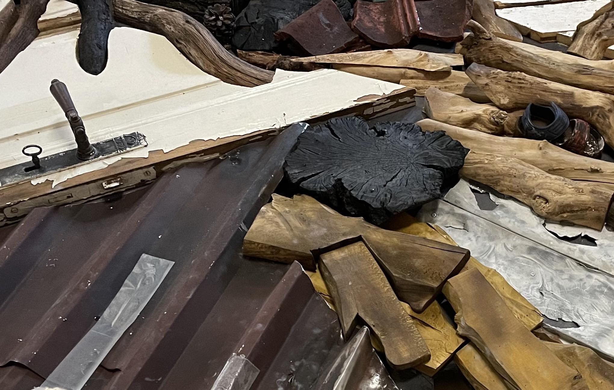 A close up of the Reclaimed Table for Climate action on display at COP-28 in 2023.