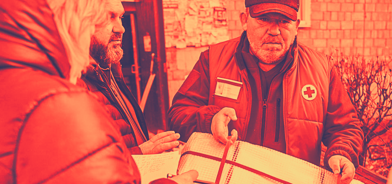 Ukraine Red Cross volunteer delivers medicine and other supplies to people in Kyiv.