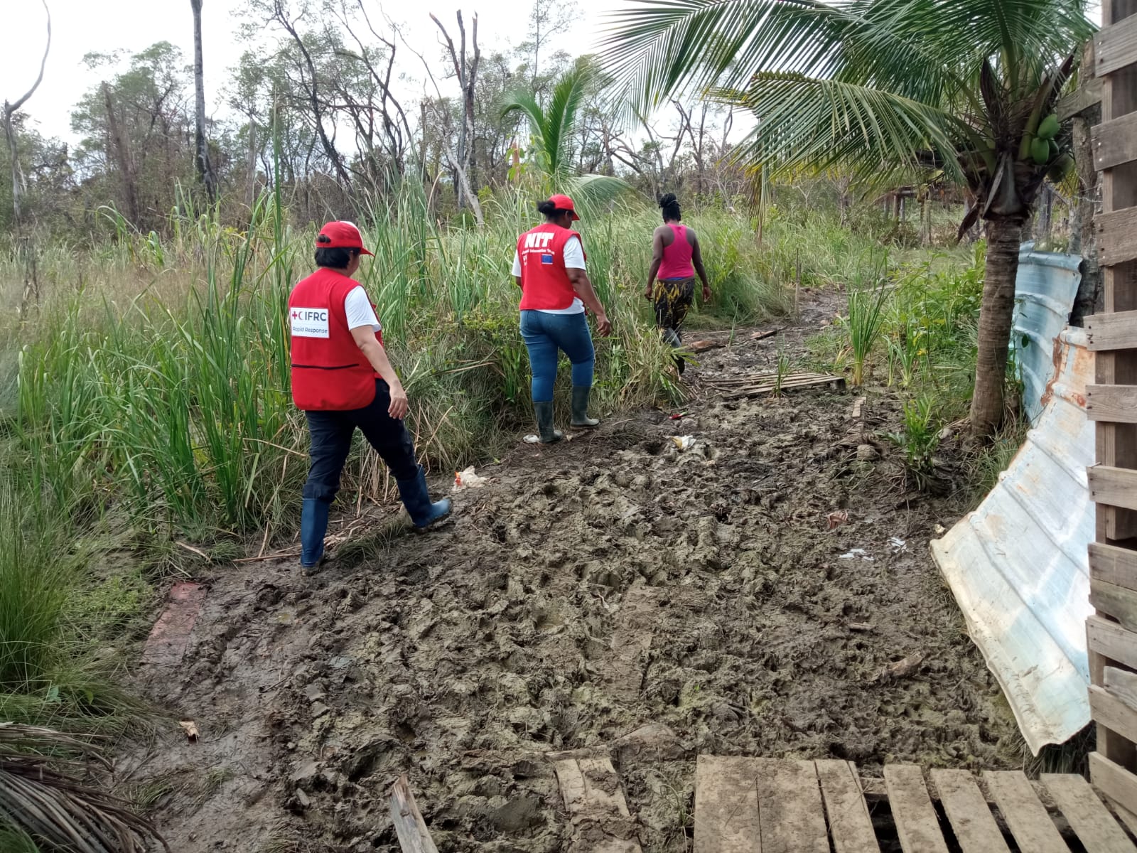 Diana Oviedo (left), IFRC operations coordinator in Central America, visits a rural community impacted by Tropical Storm Lisa in Belize.