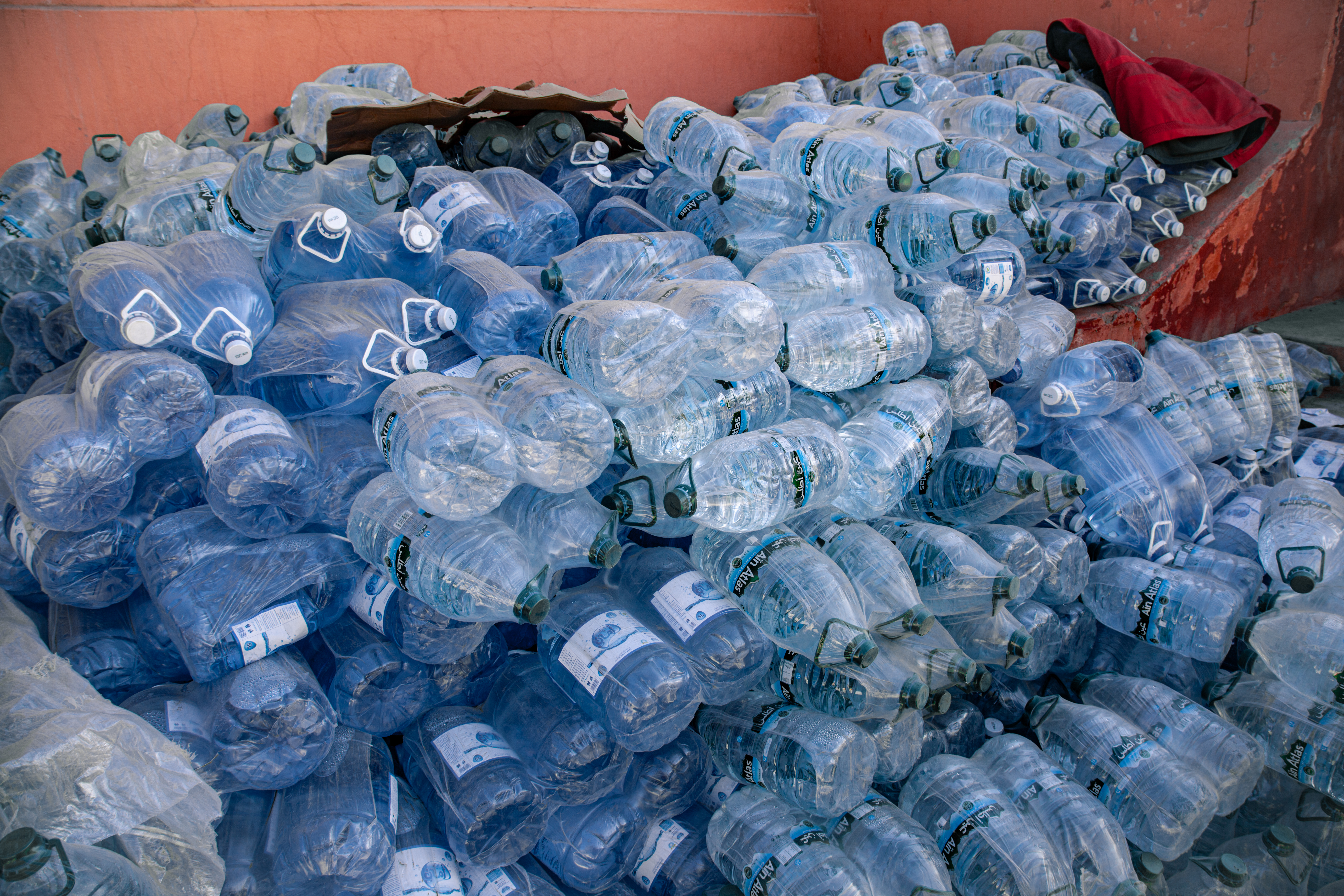 Following the September 2023 earthquake in Morocco, there was little choice but to bring in bottled water to communities whose wells and water systems were destroyed. The Moroccan Red Crescent brought thousands of bottles like these to a remote communities by truck.