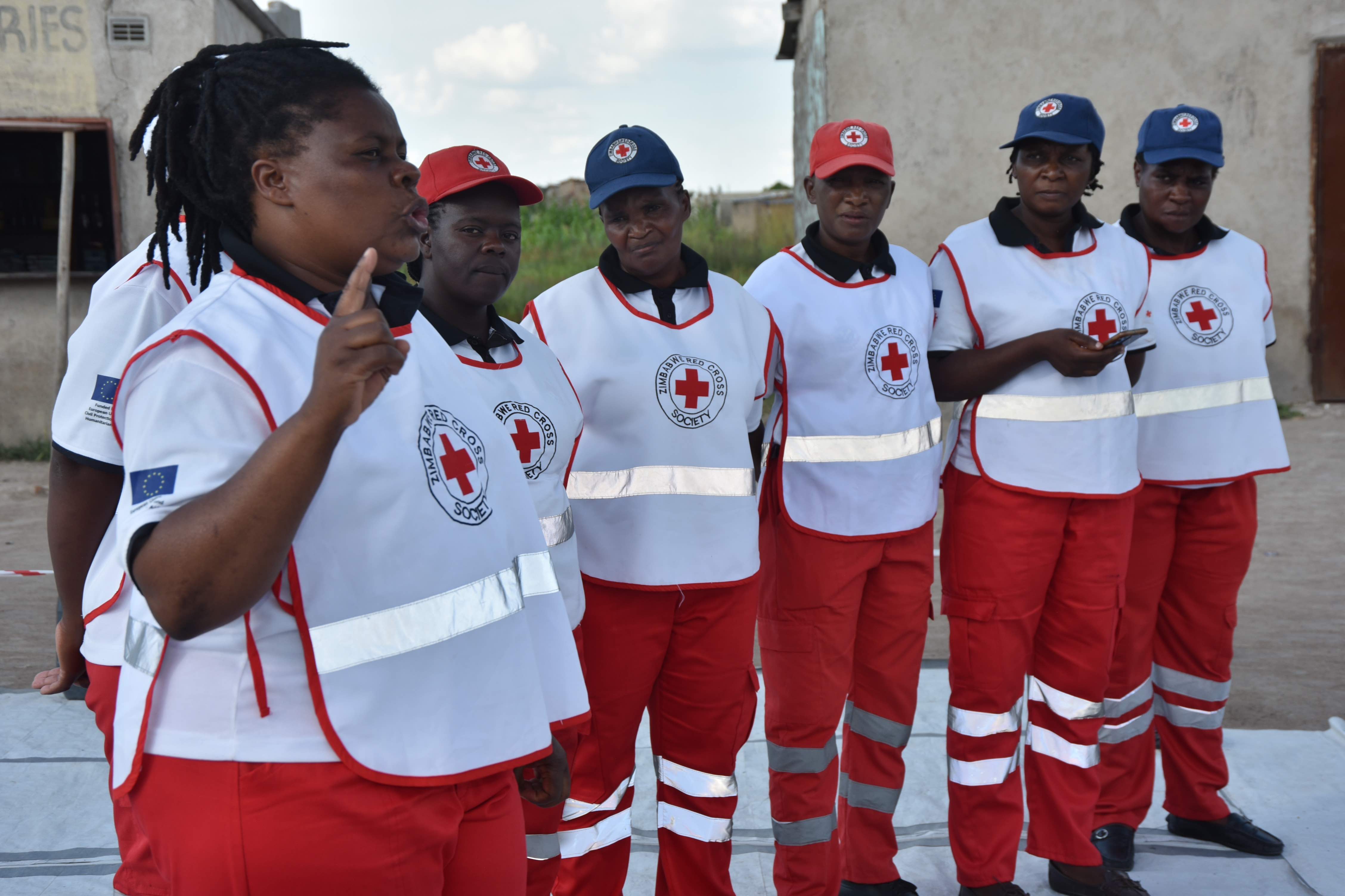 Fortune (left) and her team are the first line of defence for their community against cholera. They run the Oral Rehydration Point in Hopley Farm and live in the same community.