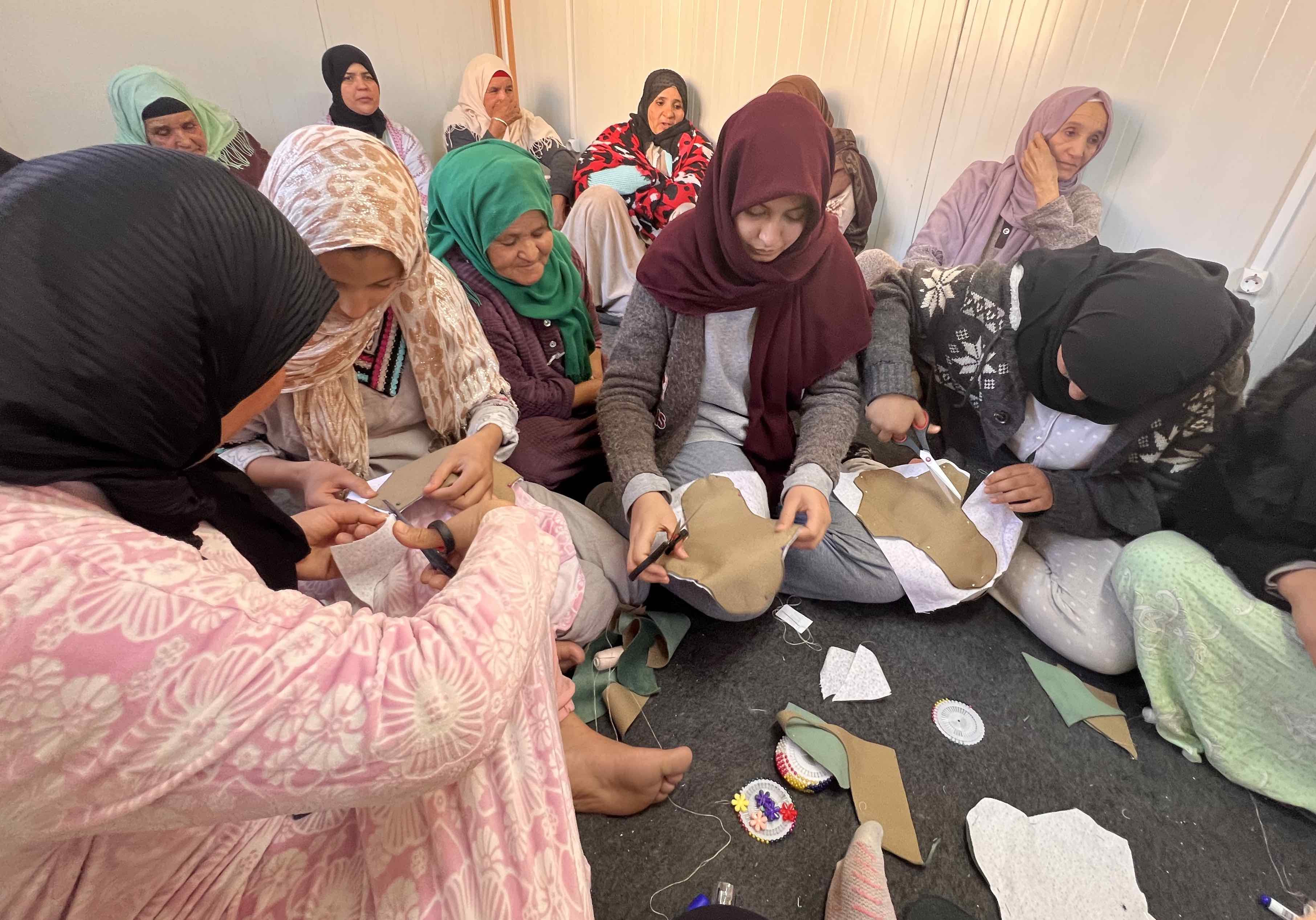In the Moroccan village of Ait Youssef, women cut fabric that will be sewn into reusable sanitary pads. They started making their own menstrual hygiene products after a devastating earthquake in September 2023 cut the village off from regular supplies.