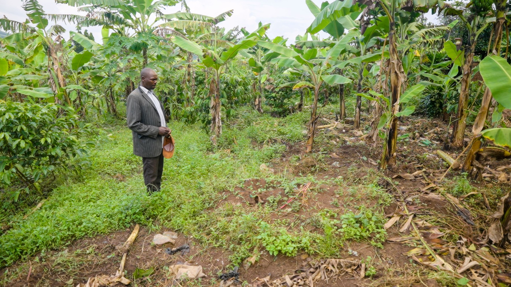 Kuteesa Samuel from Mubende stands next to the place where his wife, Monica, was buried after passing away from Ebola. 