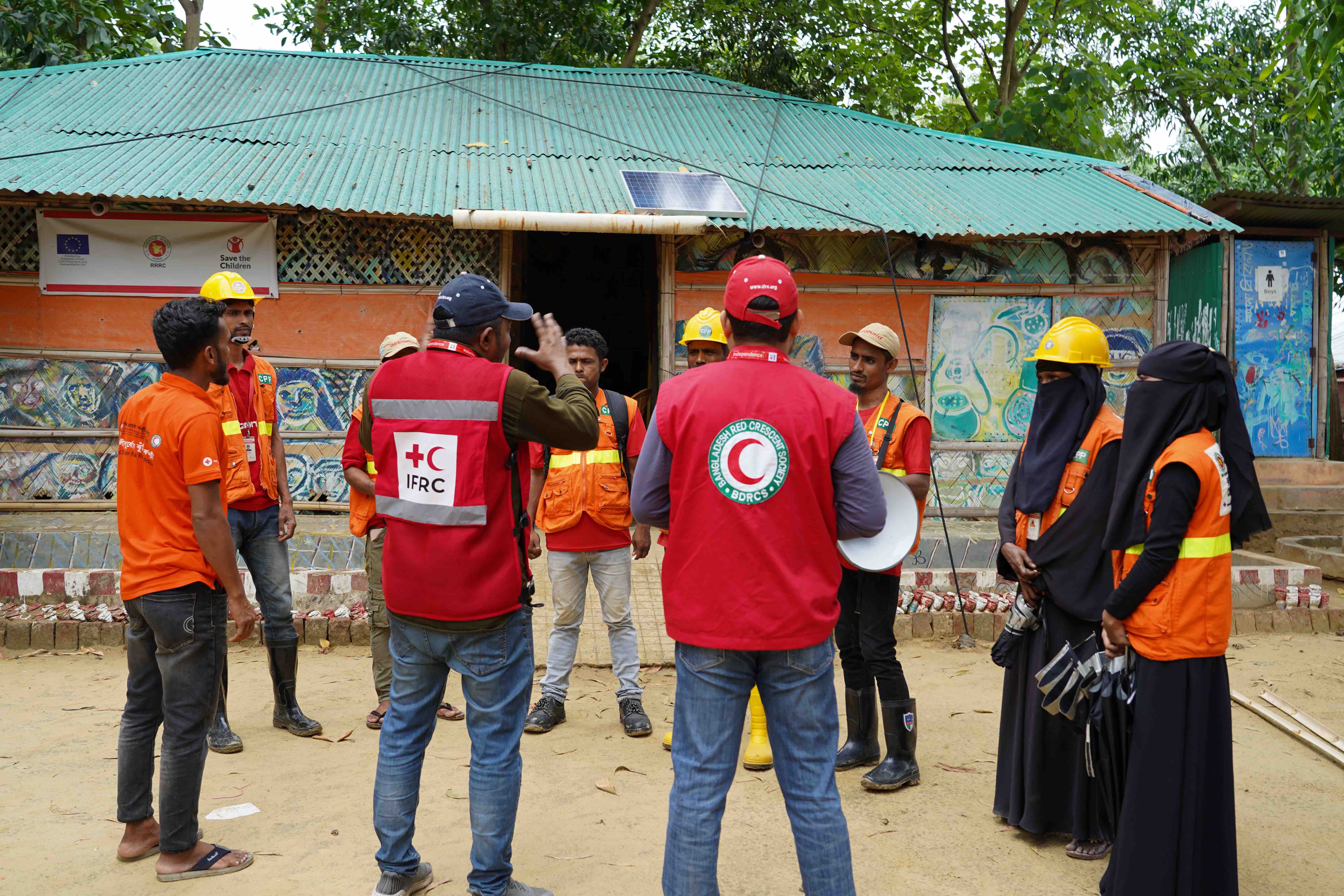 Bangladesh Red Crescent and the IFRC staff meet with Cox’s Bazar volunteers about camp cyclone preparedness plans.