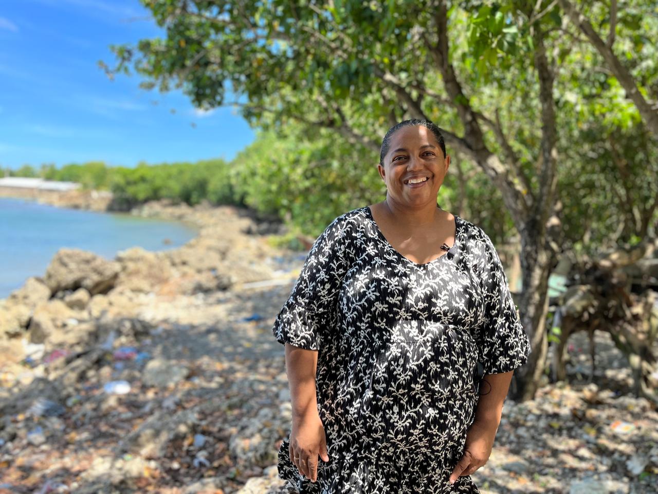 Ana María Frómeta stands on the coastline near her home in Acapulco, Río San Juan, Dominican Republic. She lost her husband and son at sea, both fishermen. Now she advises fishermen to take first aid courses to save their lives and those of their colleagues.