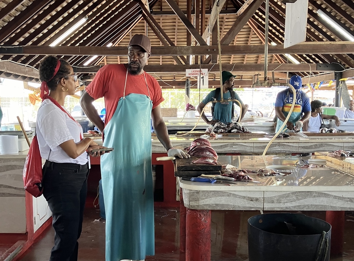 “They generally have savings, but they haven’t any left,” says Danielle Toppin, director-general of Barbados Red Cross who is shown here as part of an interview team visiting fish market workers for relief operations following Hurricane Beryl. 