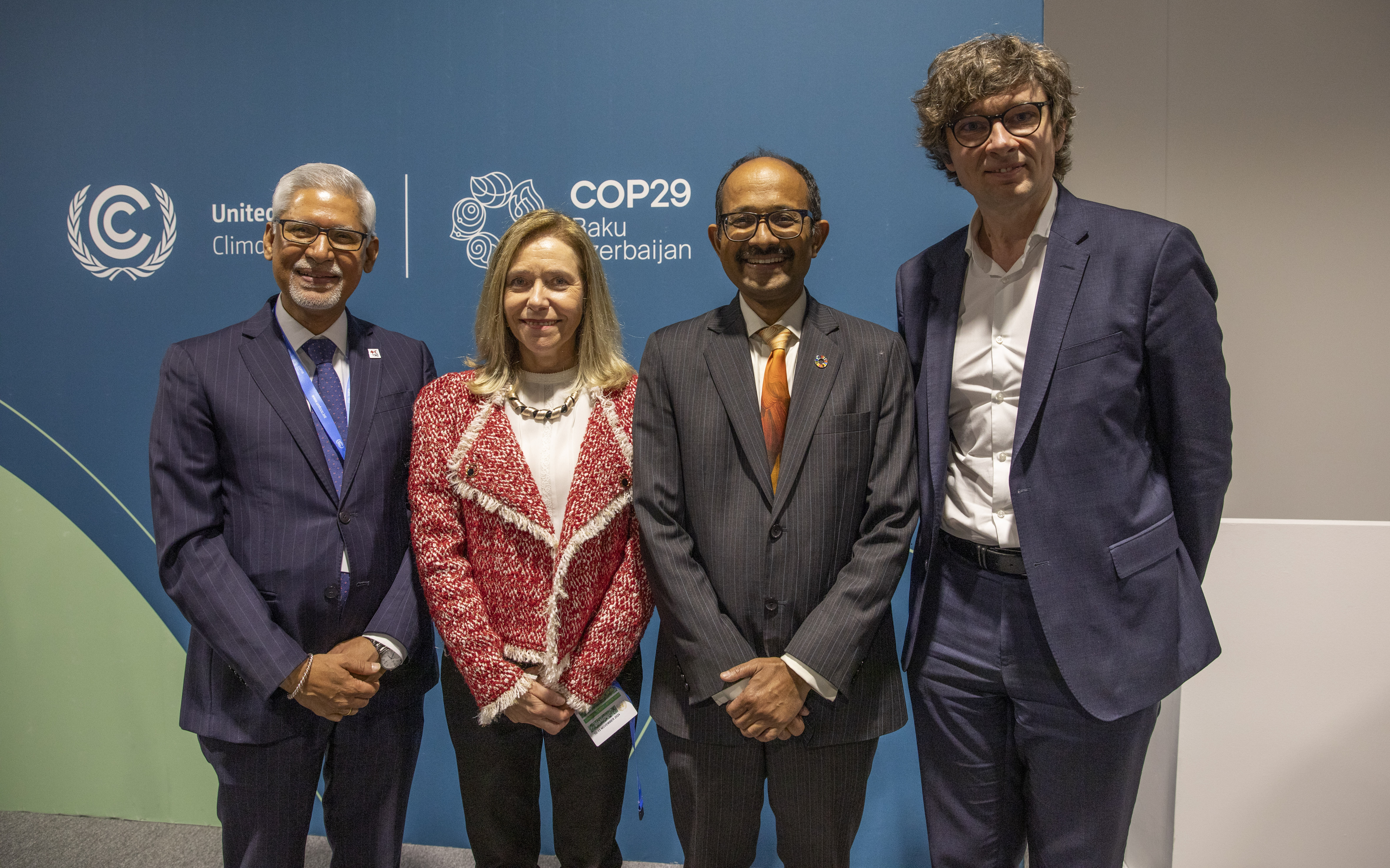 IFRC Secretary General Jagan Chapagain (left) with representatives from three other organizations leading key pillars of the EW4All: (left to right) Celeste Saulo, Secretary-General of the World Meteorological Organization; Kamal Kishore, Special Representative of the United Nations Secretary-General for Disaster Risk Reduction, and Tomas Lamanauskas, Deputy Secretary-General of the International Telecommunication Union.