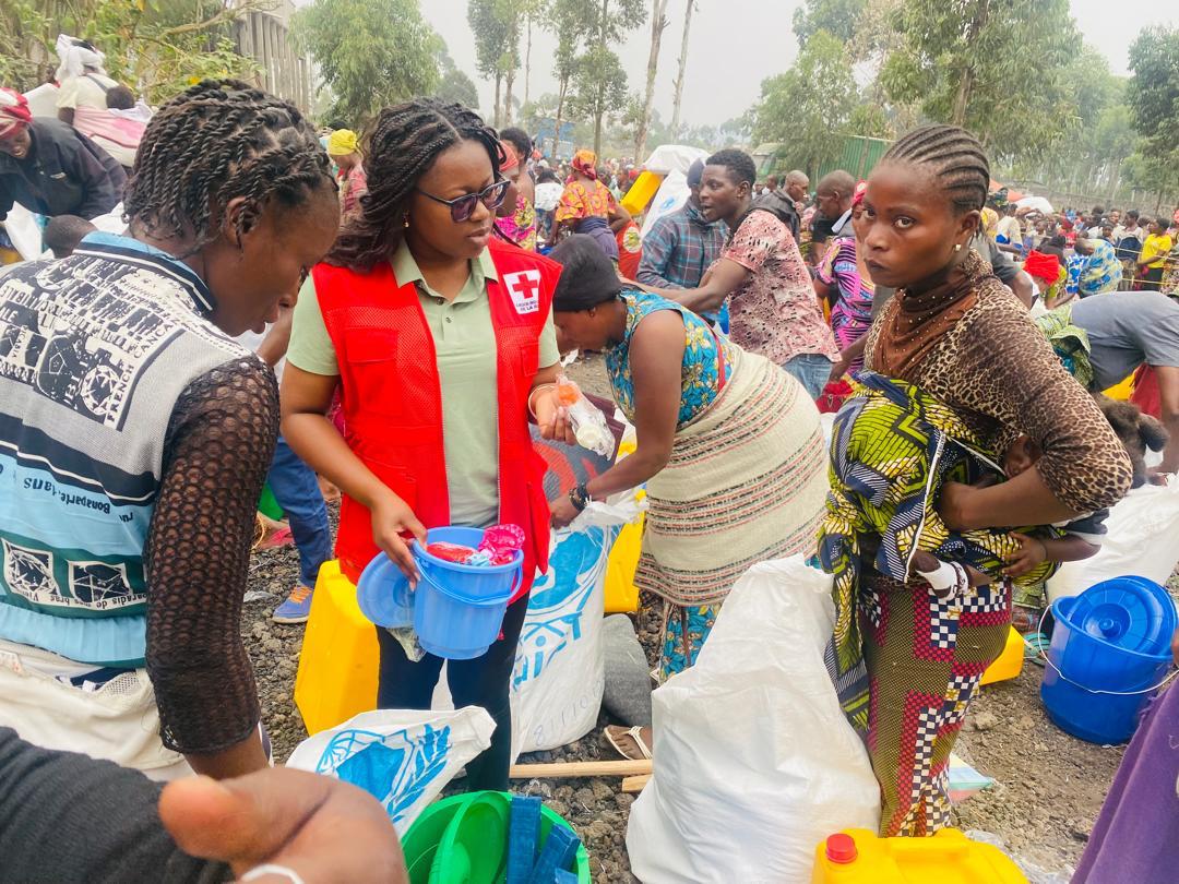 Volunteer Ange Mulanga explains the items contained in menstrual hygiene kits being provided to people displaced by violence in North Kivu, in the eastern part of the Democratic Republic of the Congo.