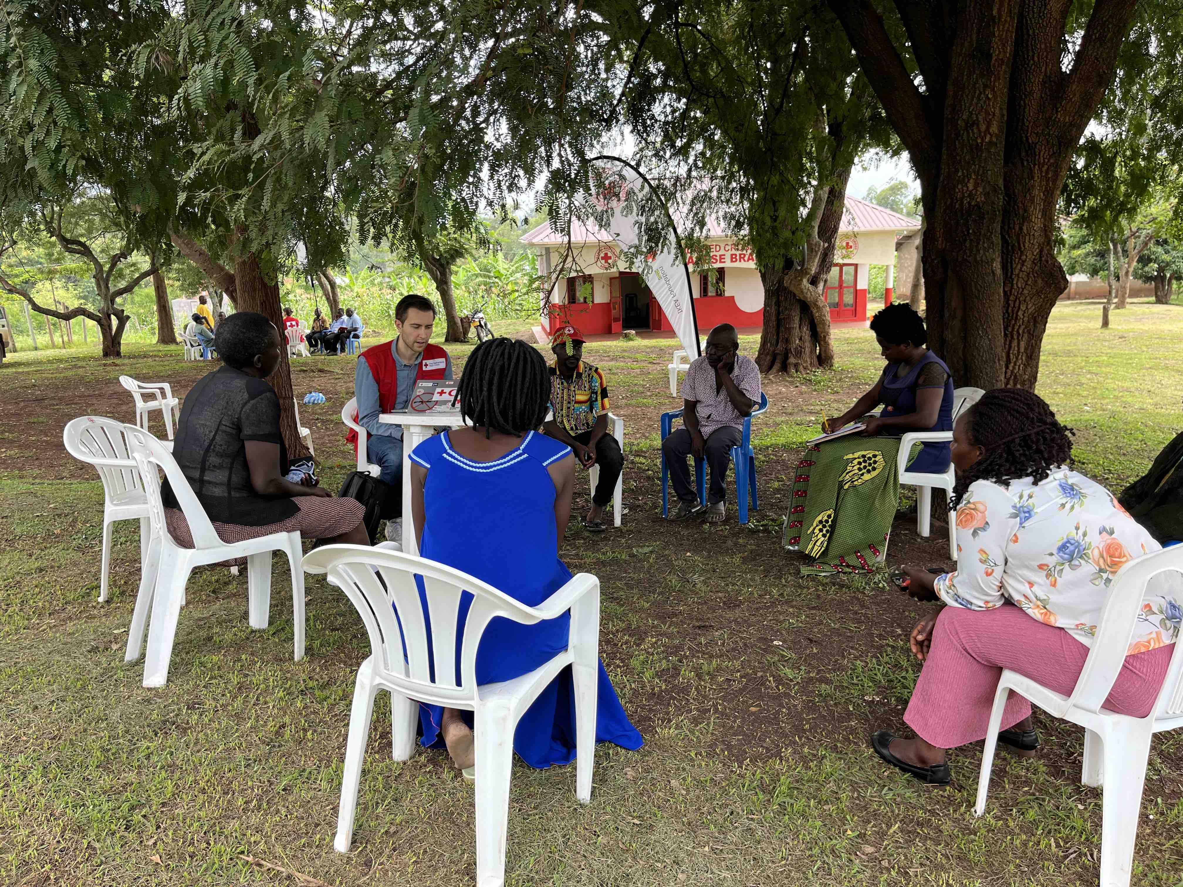 Staff and volunteers from URCS and the NLRC are engaged in focus group discussions on leveraging community engagement in anticipatory action activities.