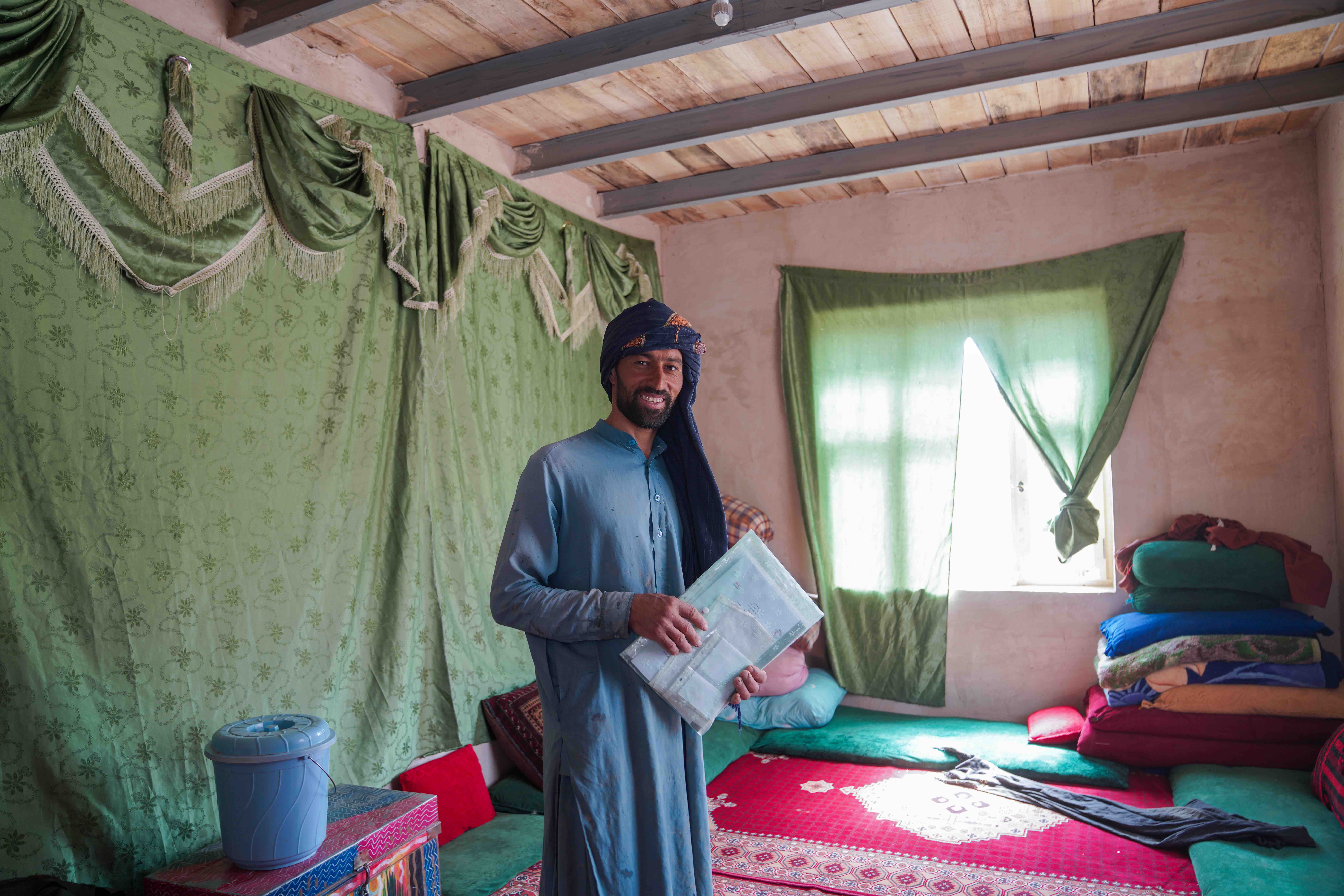 A 35-year-old resident of Gulran District, Herat, in a new shelter built by local workers and volunteers through a collaboration between the IFRC, the Afghan Red Crescent and other partners.