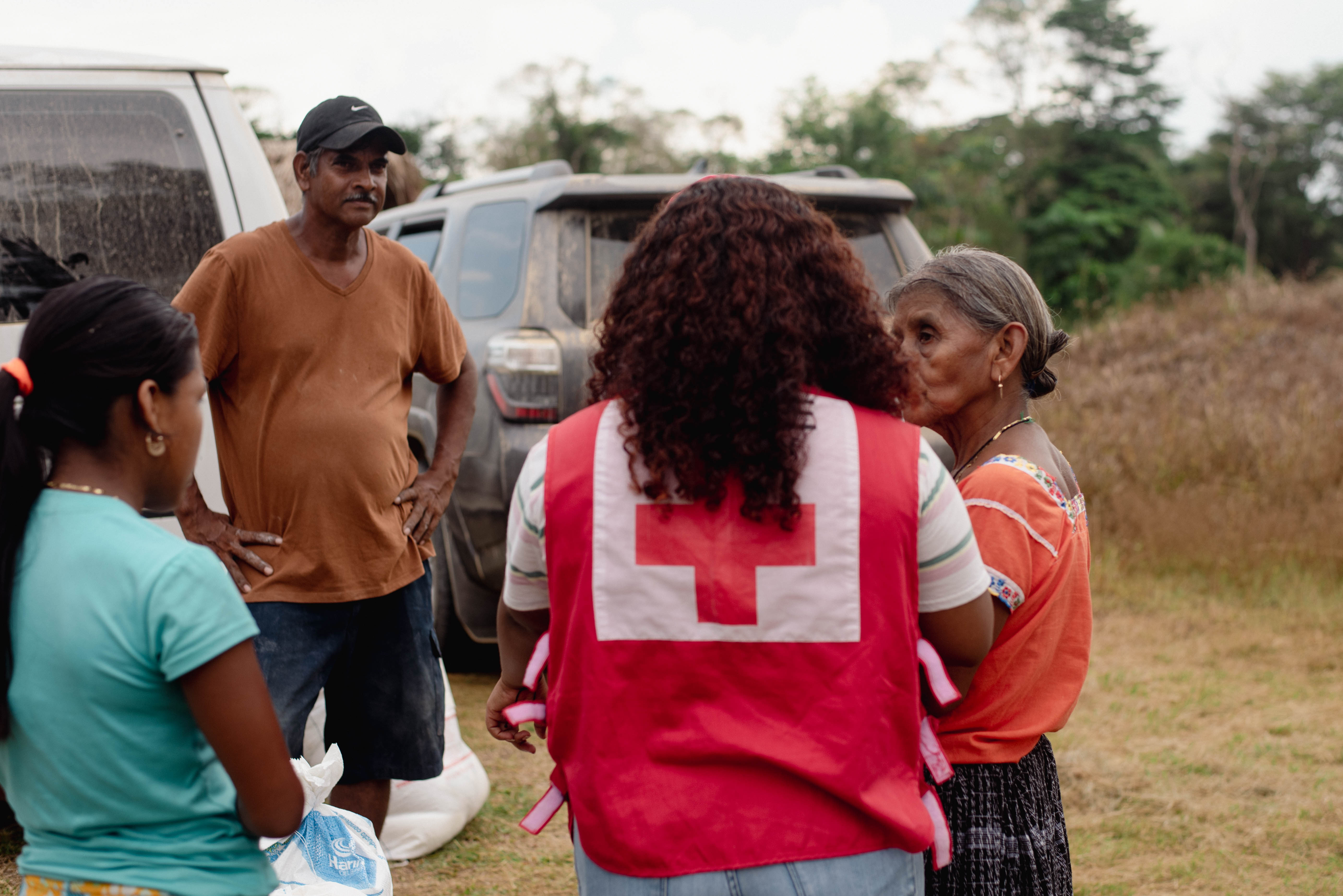 Volunteers from the Belize Red Cross distribute essential food and cleaning kits to 29 families in the Otoxhal community, close to the Guatemala border, following drought and wildfires that upended life in this heavily agricultural area. 