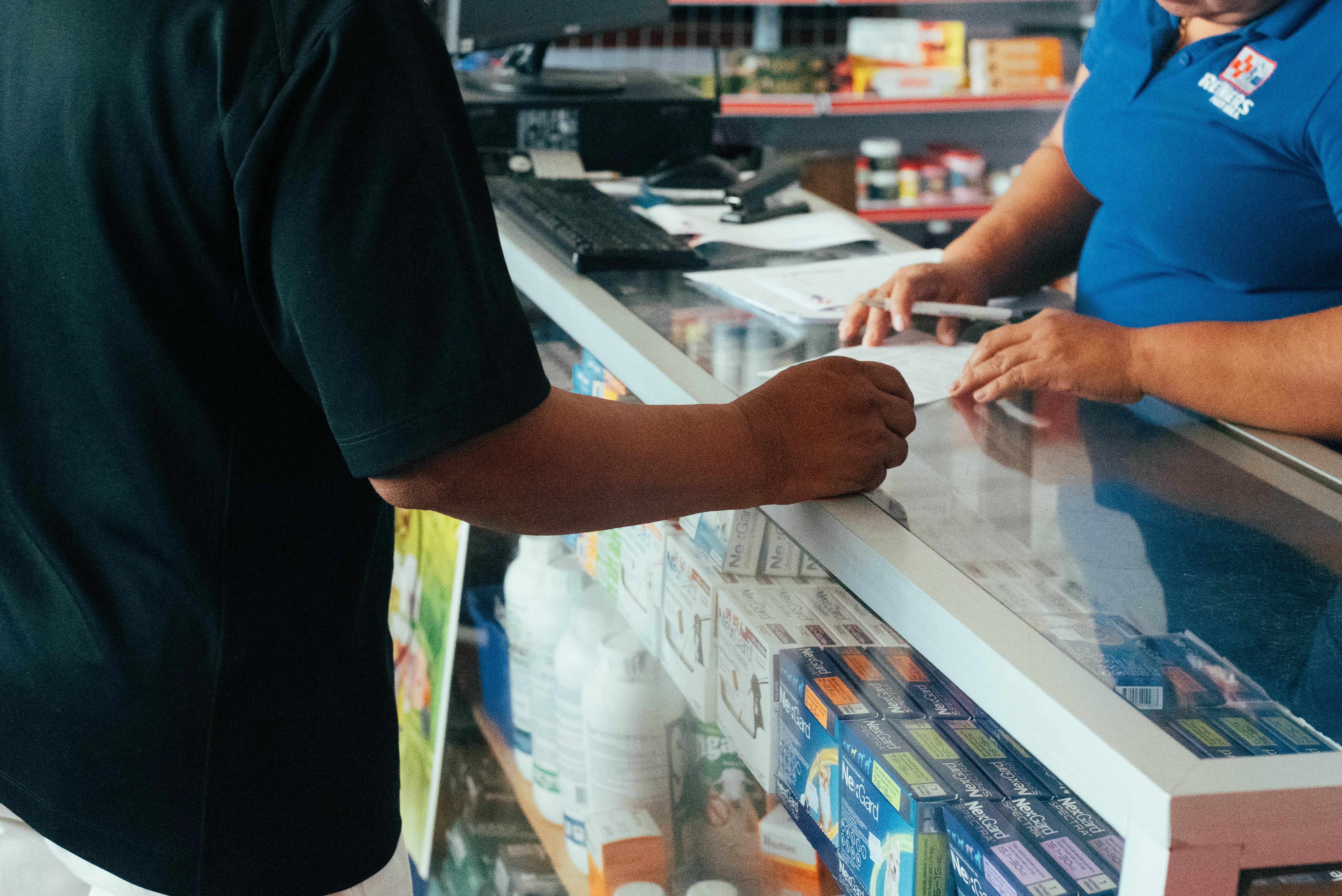 A man from San Pedro Columbia village uses vouchers provided by the IFRC and the Belize Red Cross at a local businesses in order to buy tools, seeds, and other implements that will help them recover their livelihoods. 