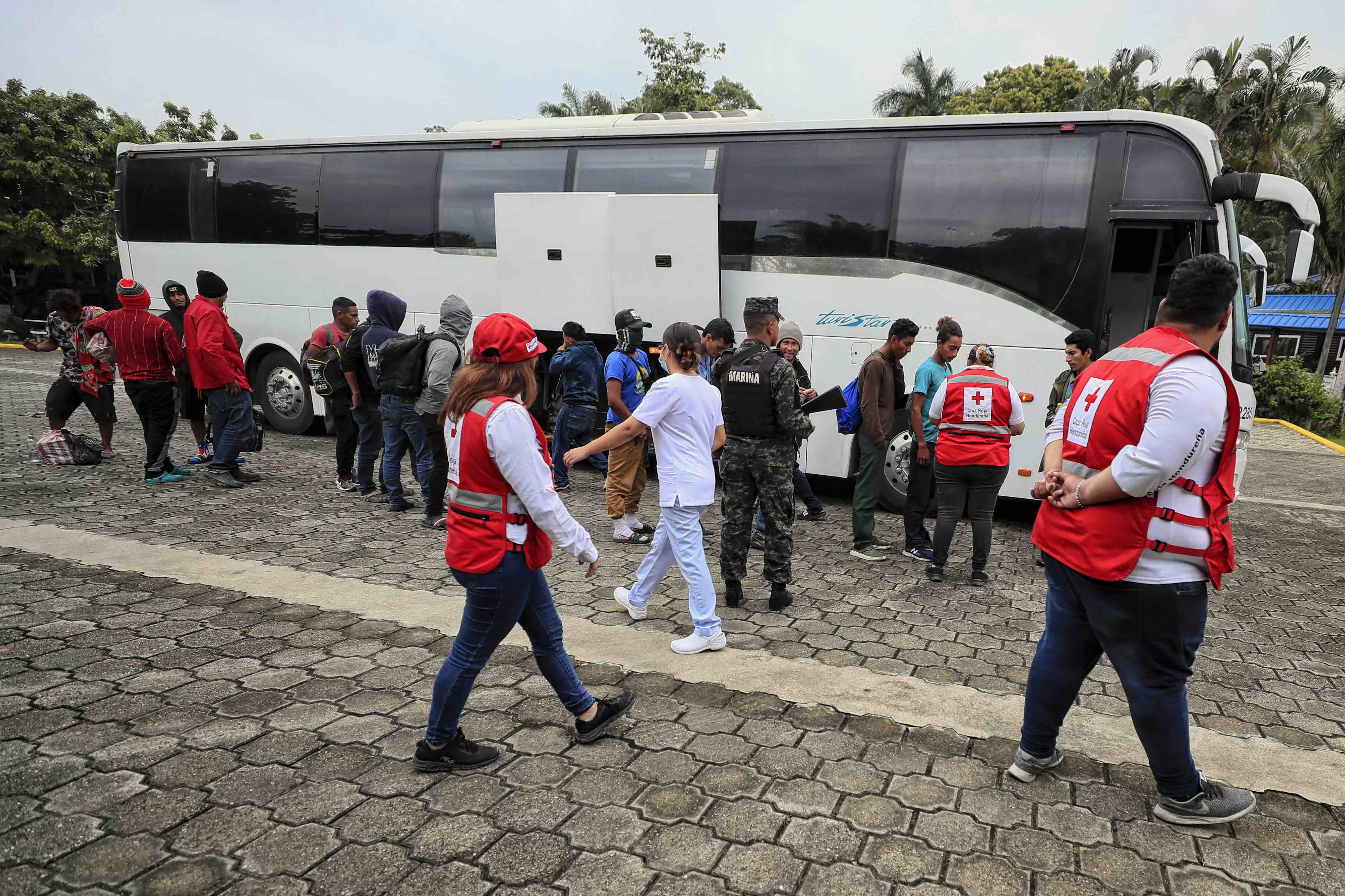 Honduran Red Cross staff receive migrants and provide services at the Centre for Attention to Returned Migrants (CAMR) in Omoa, a town on the Caribbean coast of Honduras.