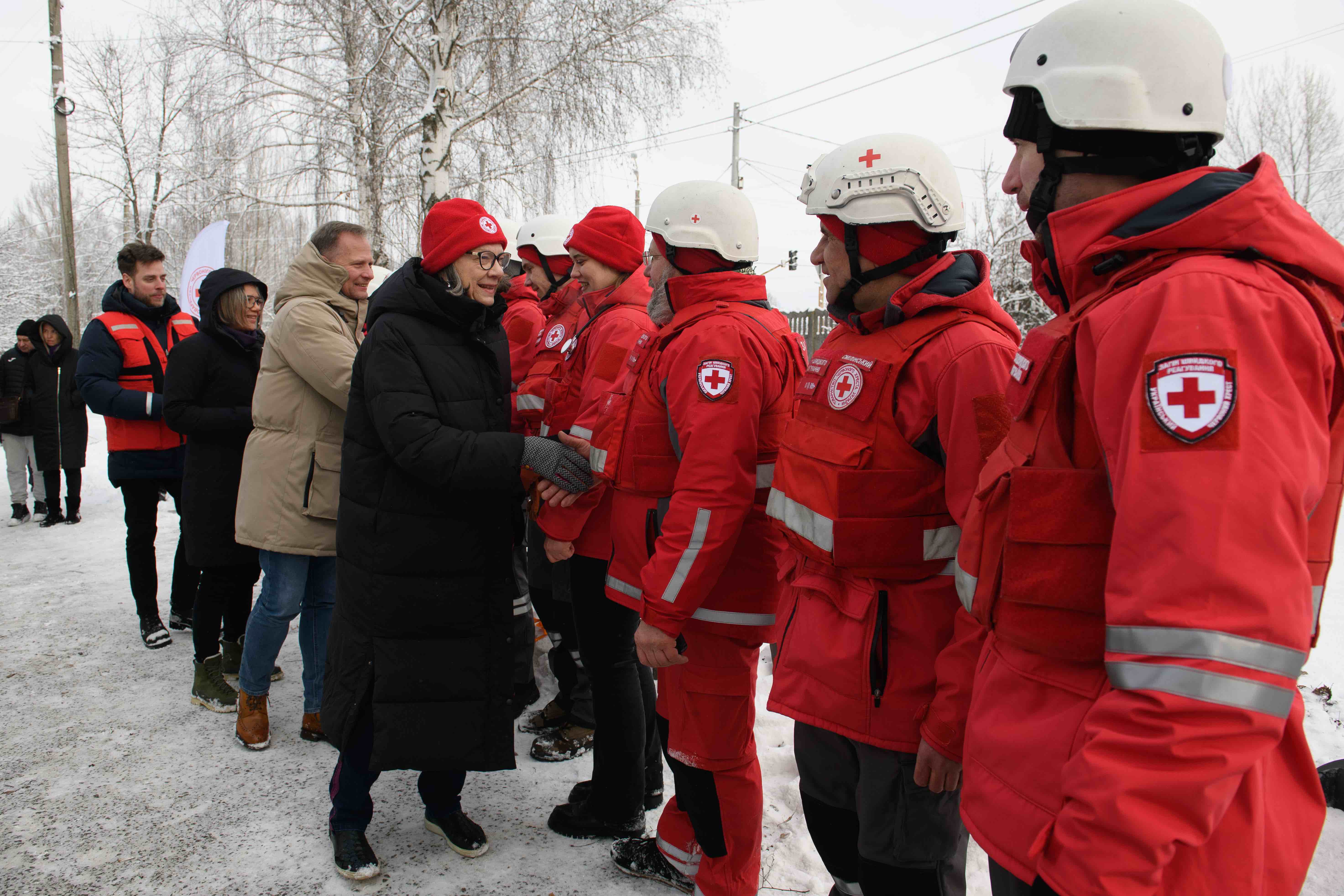 IFRC president Kate Forbes greets members of a Ukrainian Red Cross first responders team in Kyiv, Ukraine.