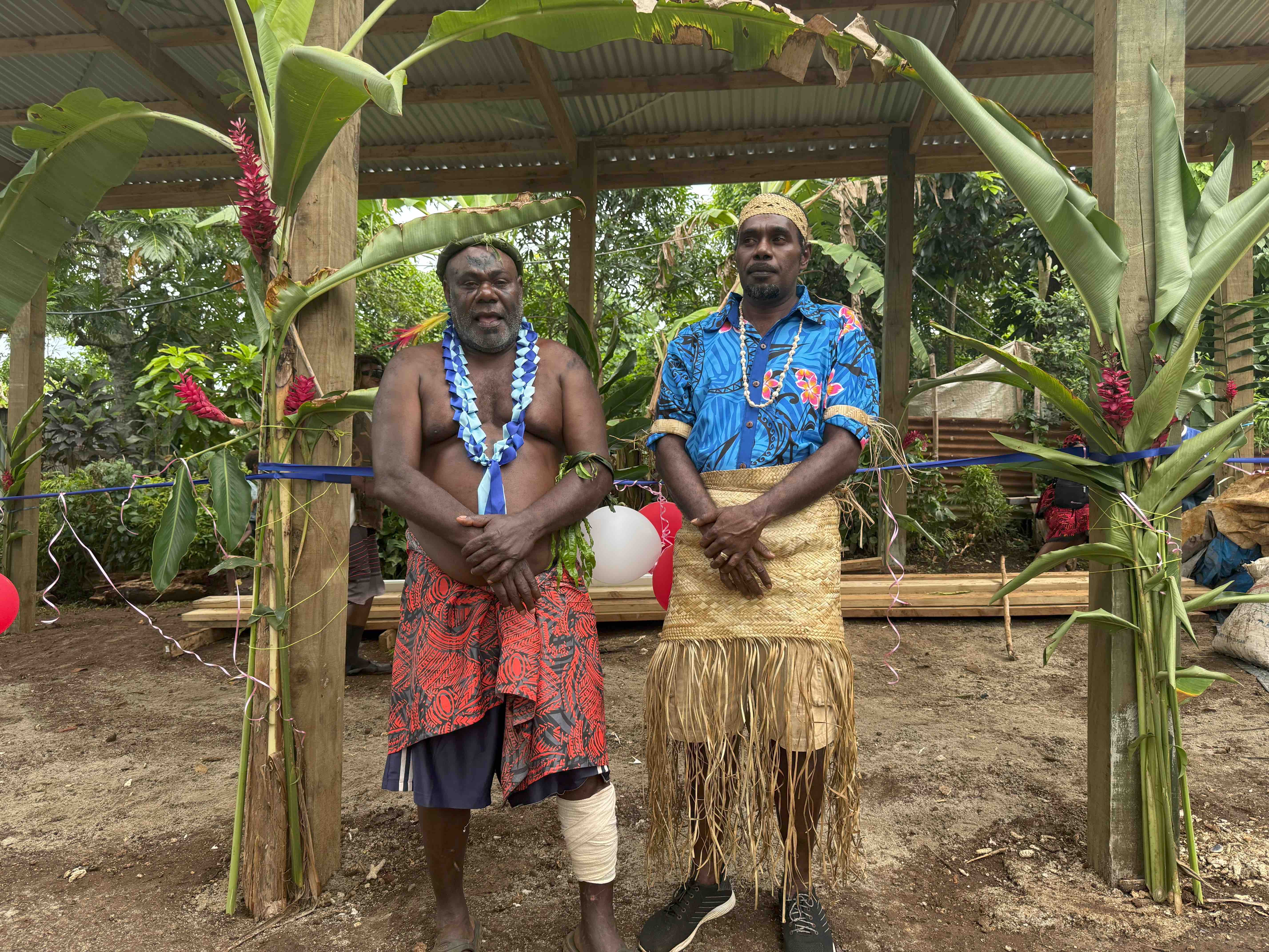 Britano chairman Andrew Nayo and chief George John pose by the newly constructed evacuation centre.jpg