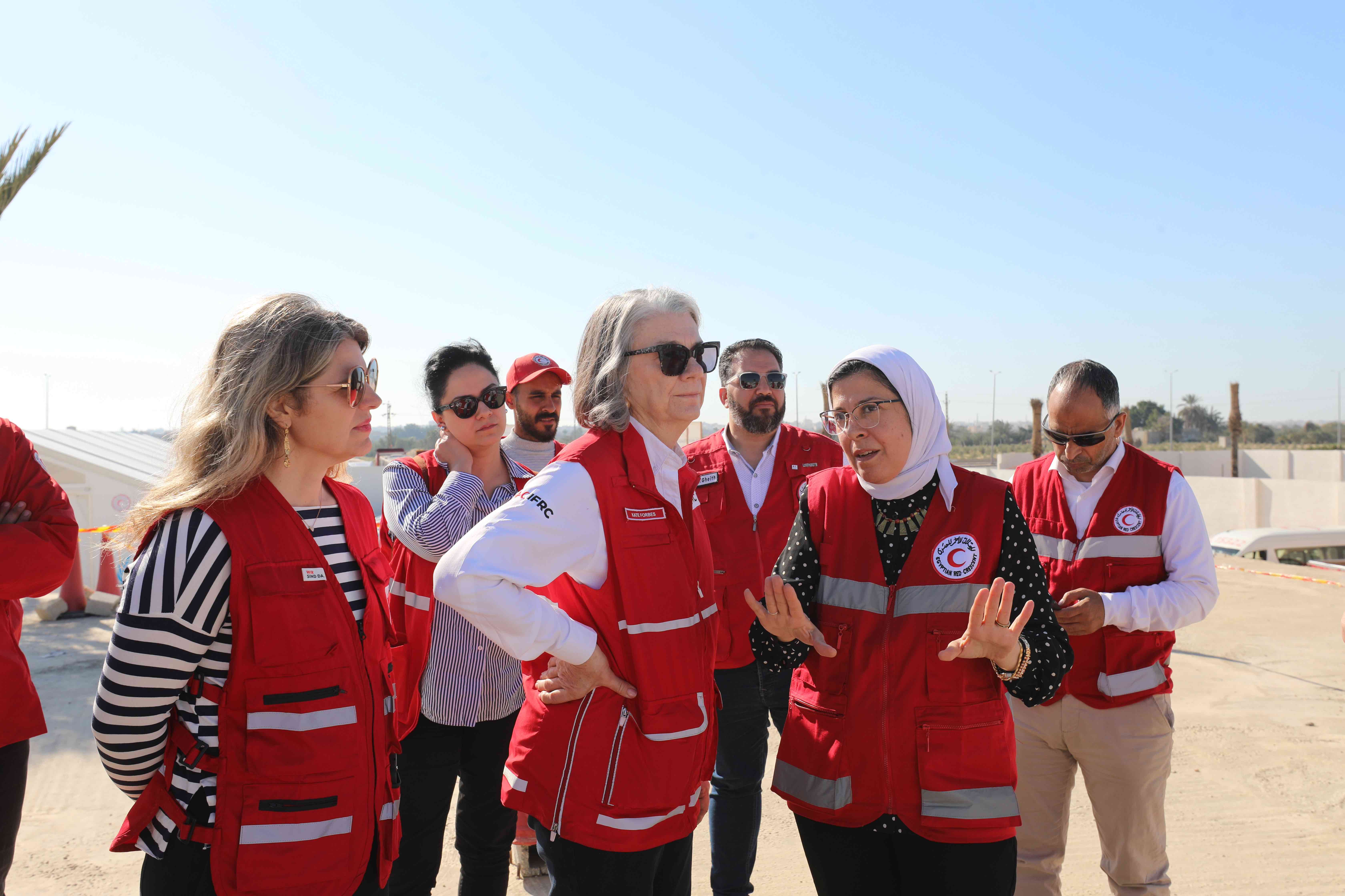 IFRC president Kate Forbes listens as Dr. Amal Emam, CEO of the Egyptian Red Crescent Society, explains the situation for humanitarian aid deliveries at the Rafah border.
