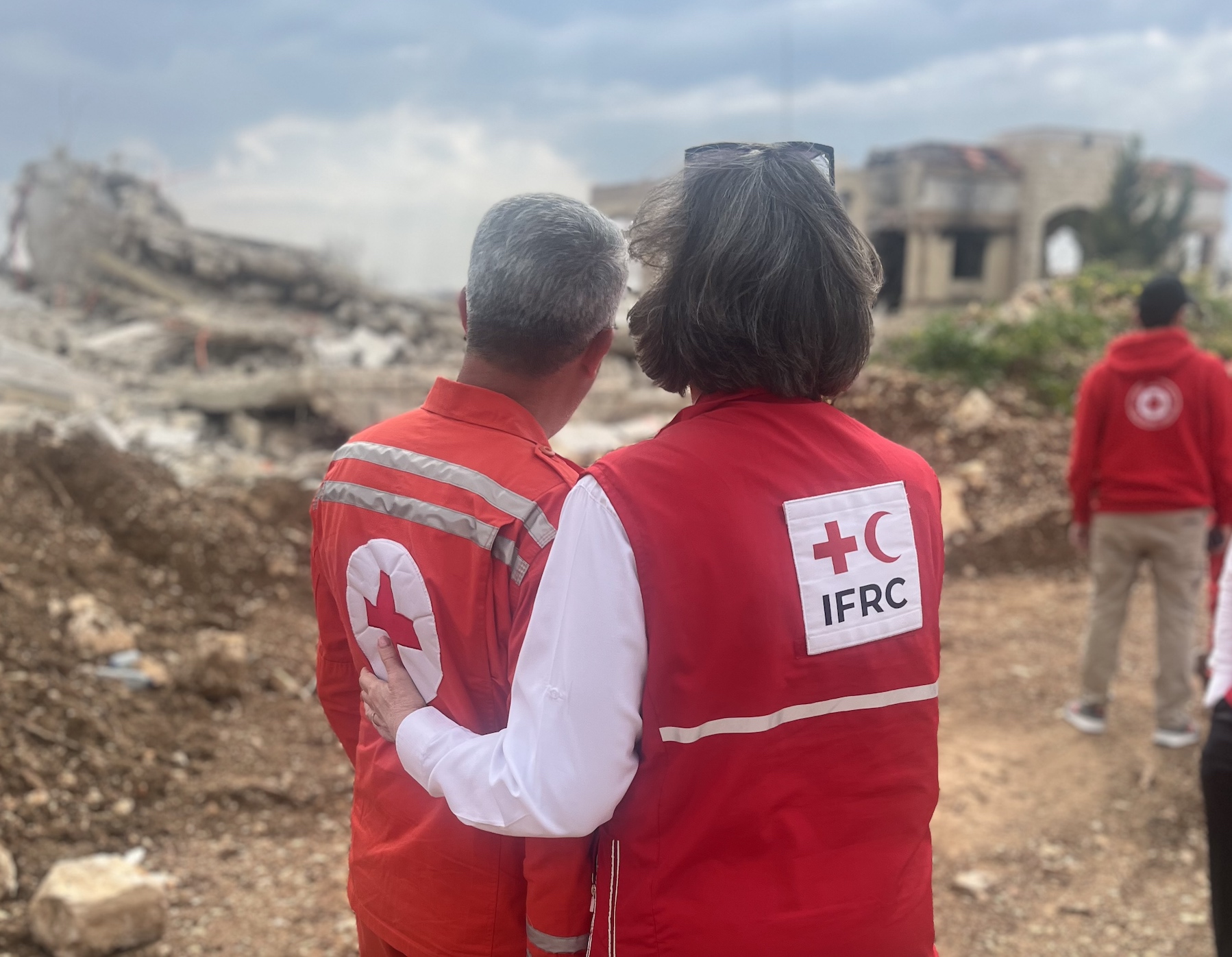 IFRC president Kate Forbes and Ali Saad, a staff member from the Lebanese Red Cross Society, survey the damage cause by ongoing conflict in the southern coastal town of Tyre.