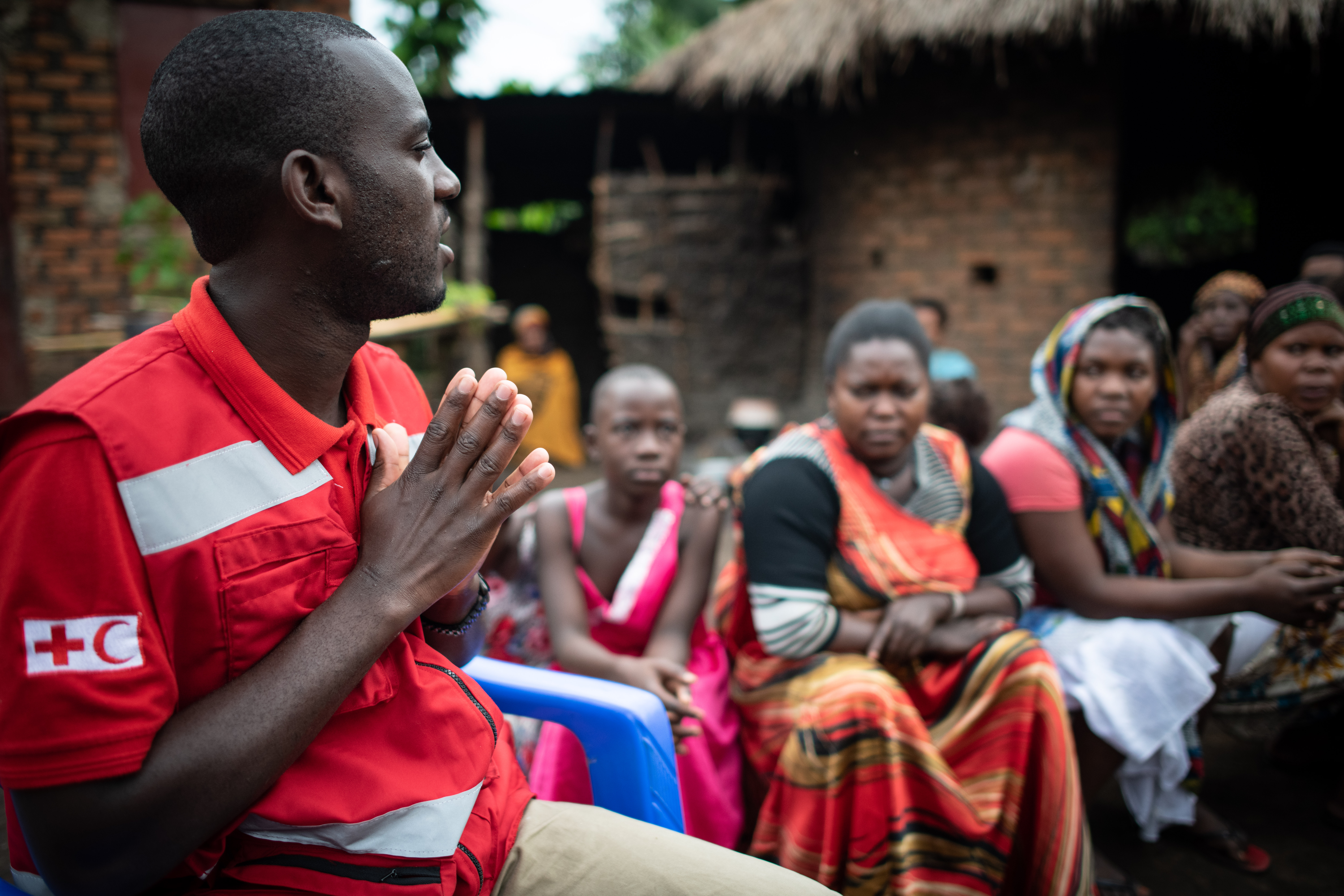 Dr. Joseph Kasumba, CP3 officer for the Uganda Red Cross engages a community in Bundibugyo, Uganda, about Ebola risks.