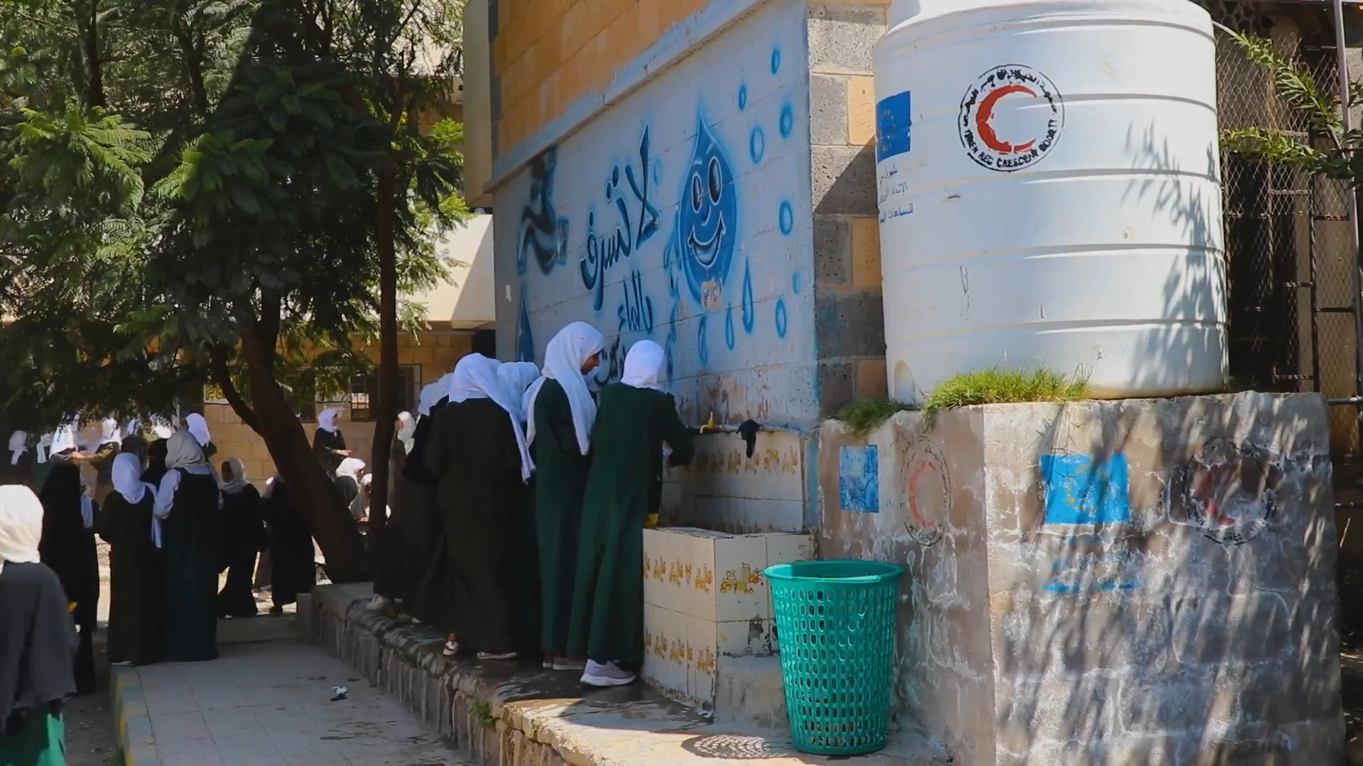 Young girls line up at a new row of water spigots installed at Asmaa School for Girls by the Yemeni Red Crescent with support from the IFRC and the European Union.