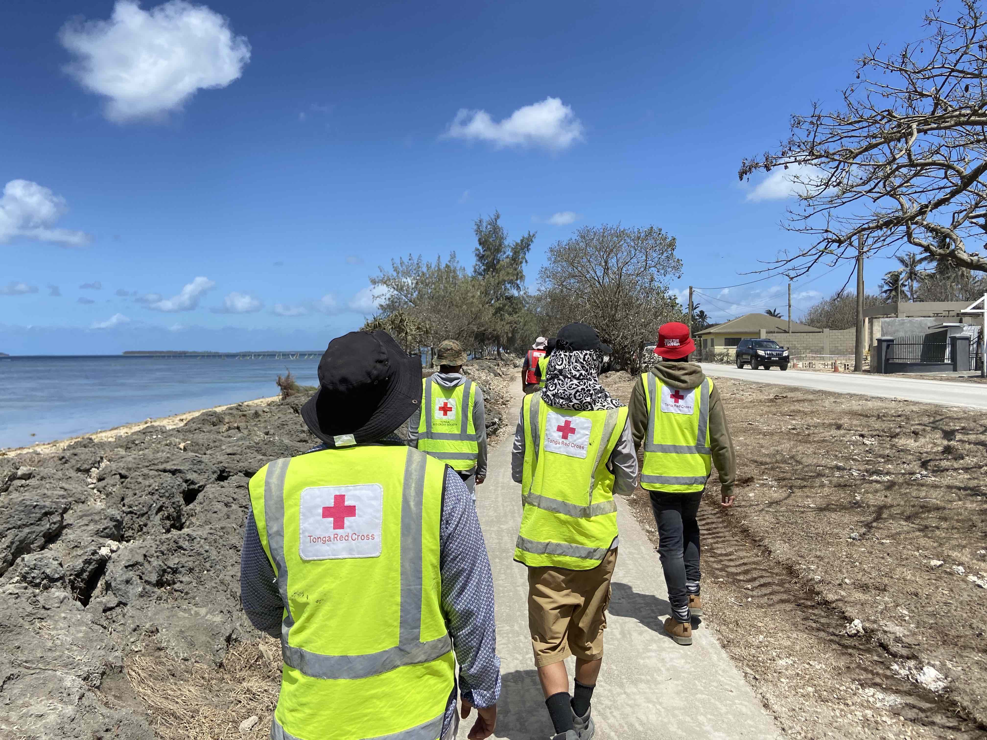 Red Cross volunteers in Tonga traveling to communities that were severely affected by the volcanic eruption and tsunami in 2022.