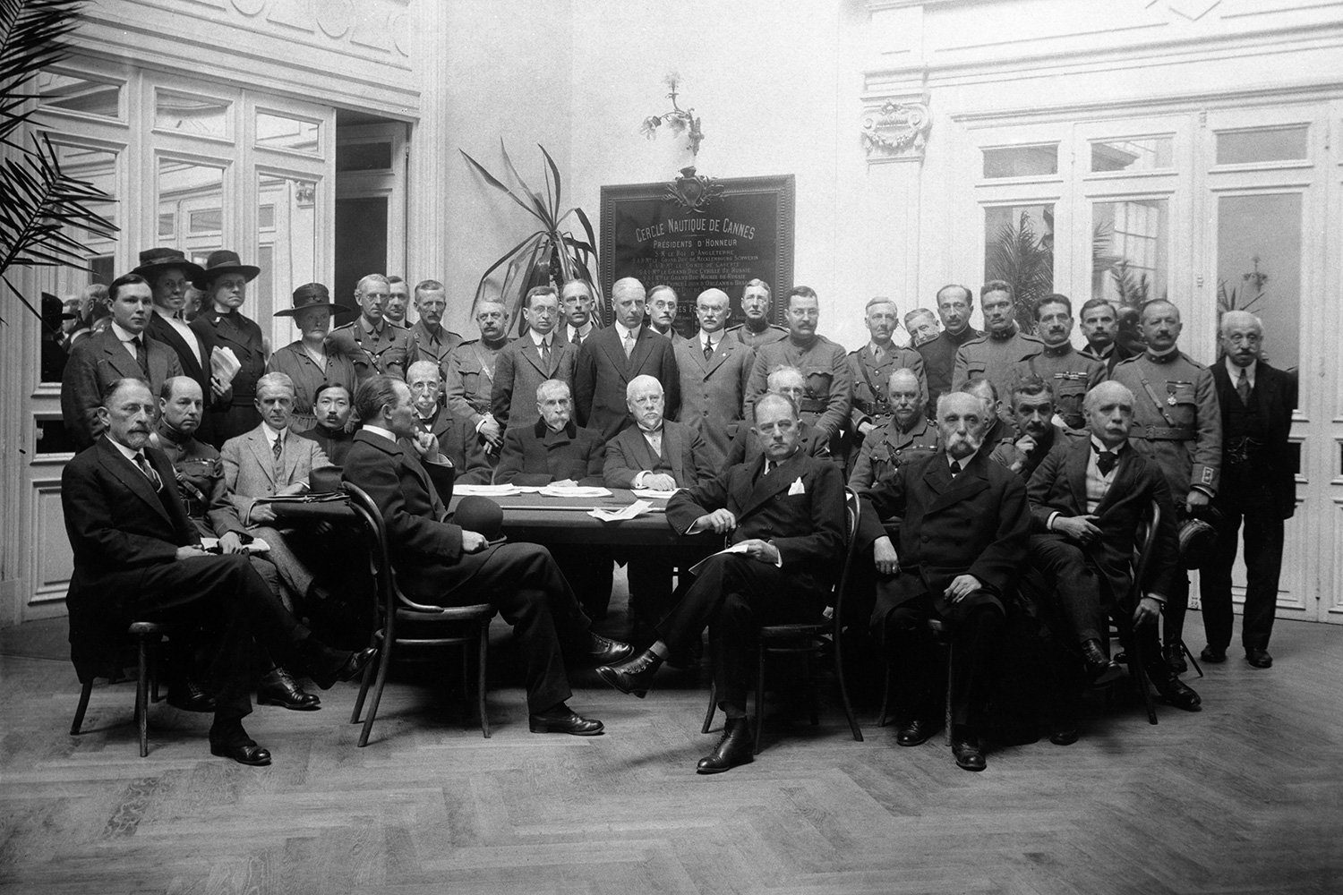Group of delegates to the Cannes Medical Conference in April 1919. Henry Davison is seated at the front, in the middle right of the photo, legs crossed.
