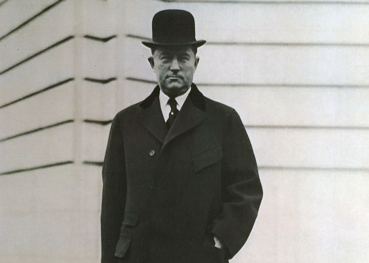 Henry P. Davison, founder of the League of Red Cross Societies, in front of J.P. Morgan & Co offices, on the corner of Wall Street and Broad Street, New York City. 
