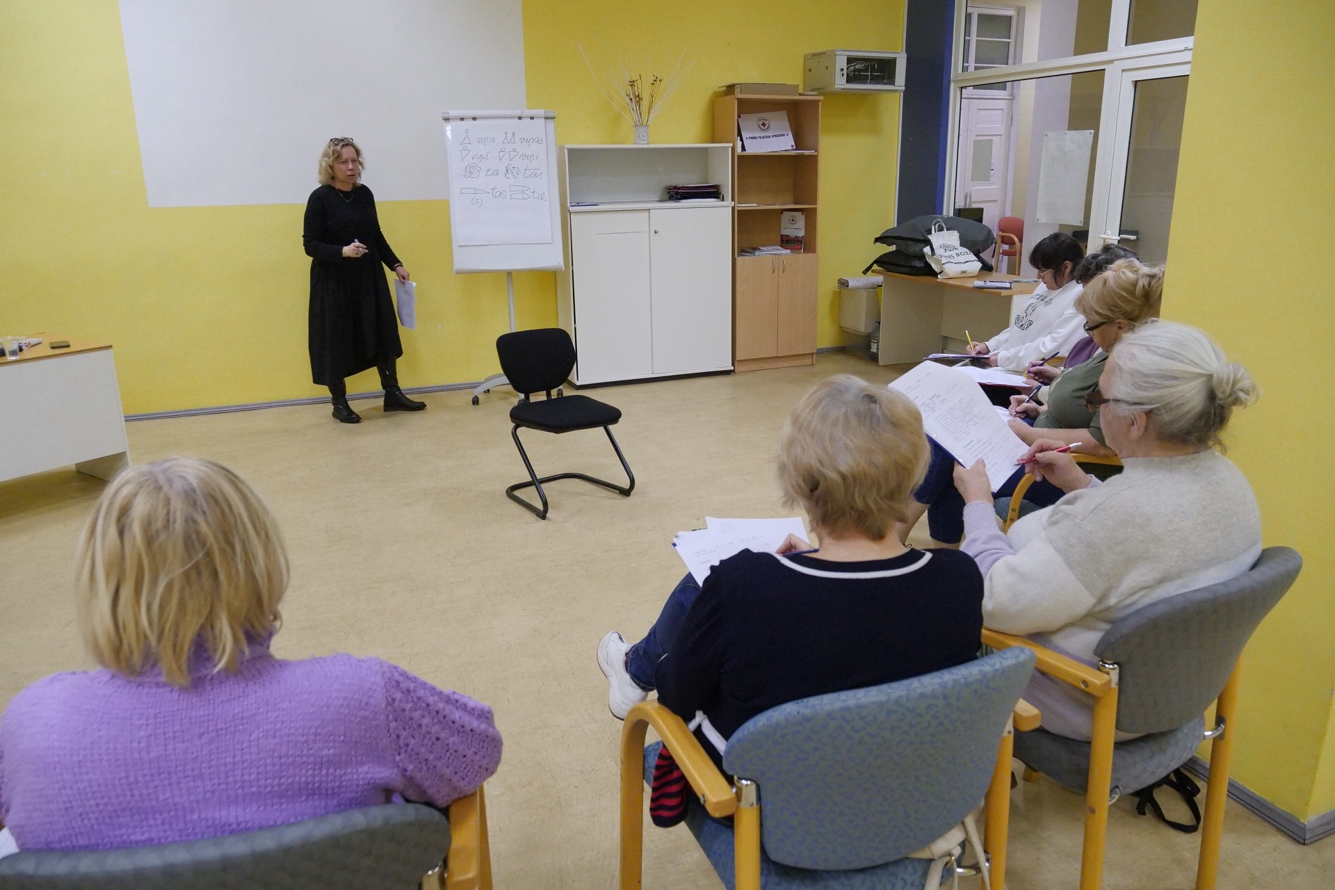 A teacher for a Latvian Red Cross language programme explains important phrases in the Latvian language to Ukrainians who fled the escalation of conflict and who are now hoping to improve their lives in Latvia.