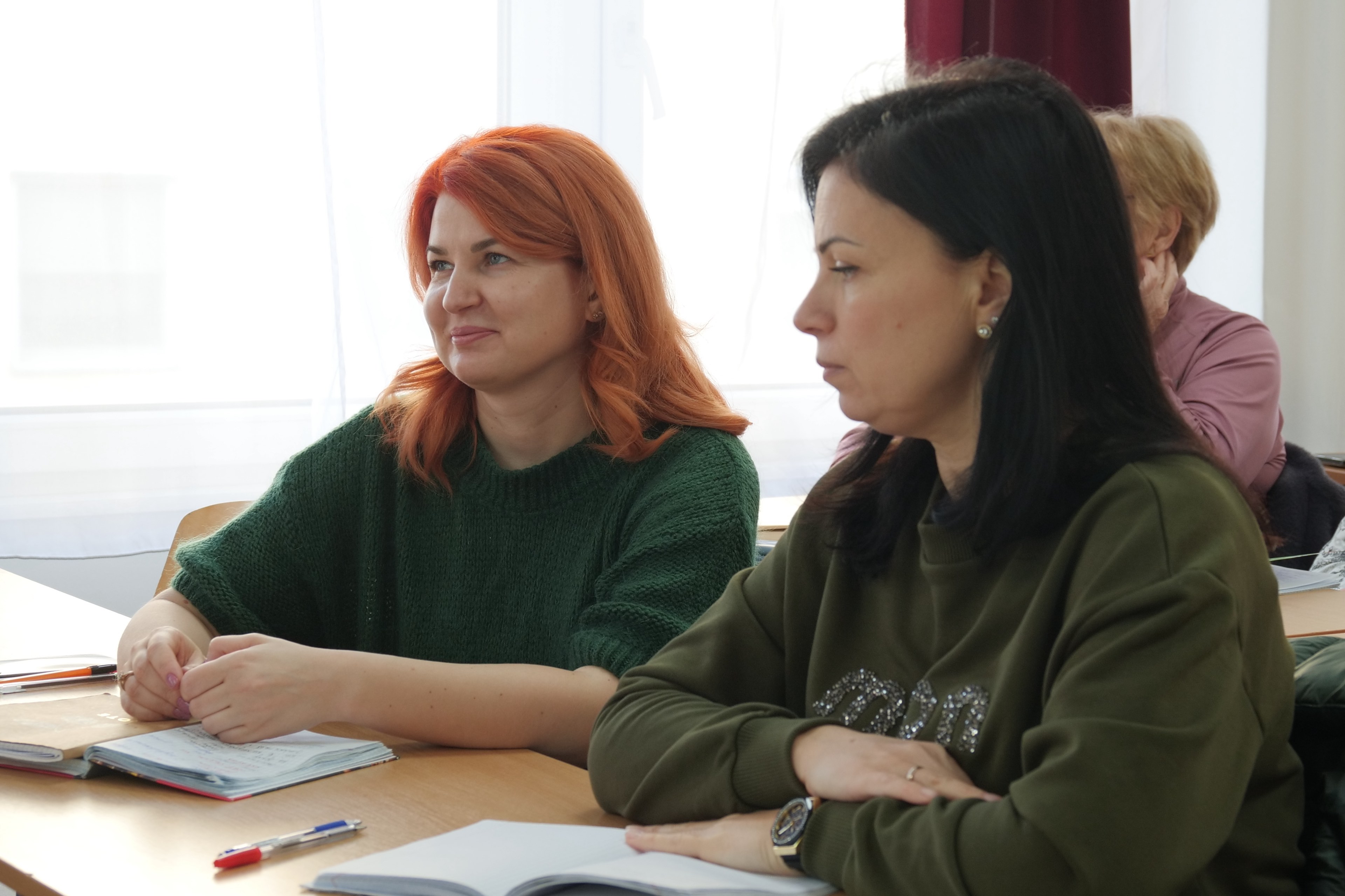 Mila (left), who has been living in Hungary with her son after fleeing Ukraine, takes part in a language class in Hungary.