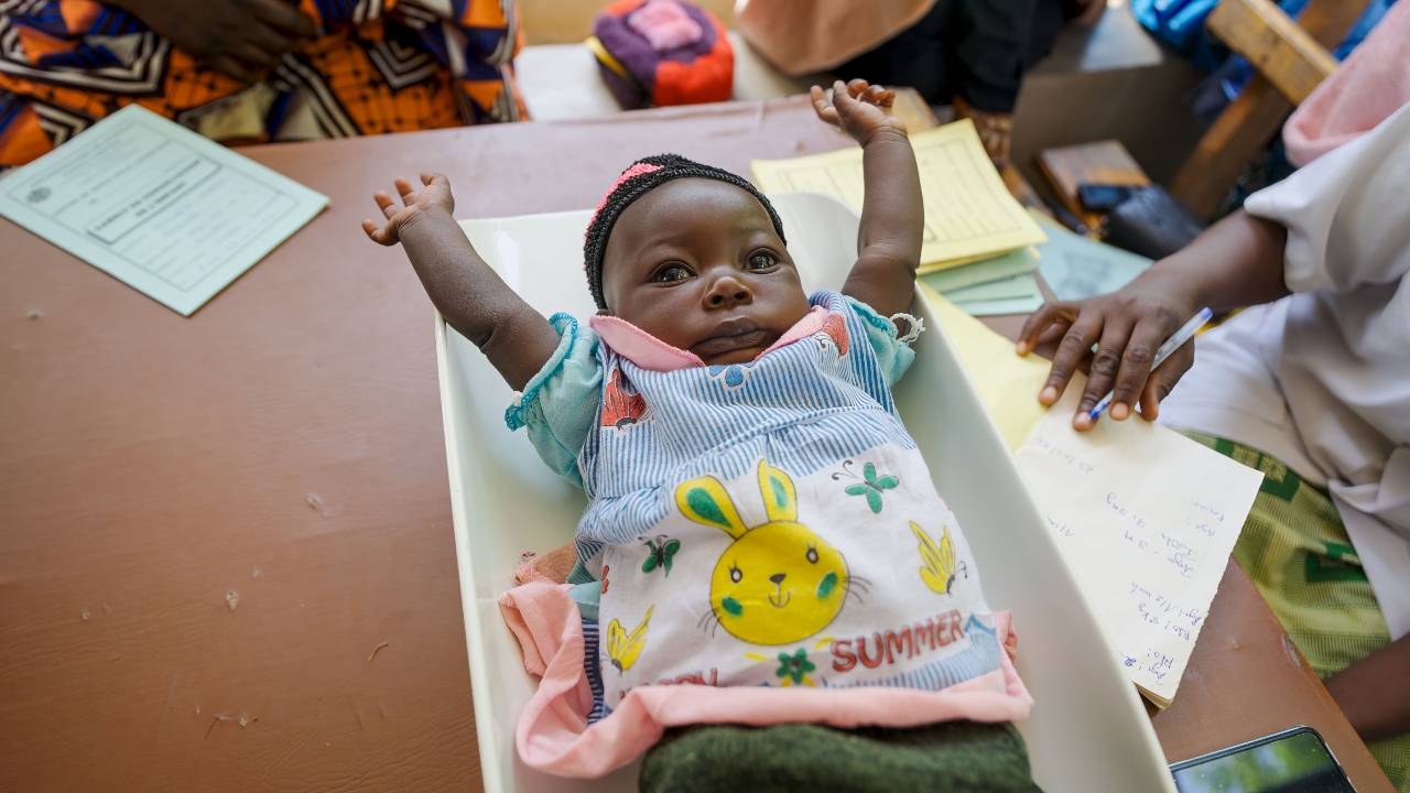 A baby girl from Mayo-Oulo village, Cameroon, receives a health check up prior to being vaccinated against measles.