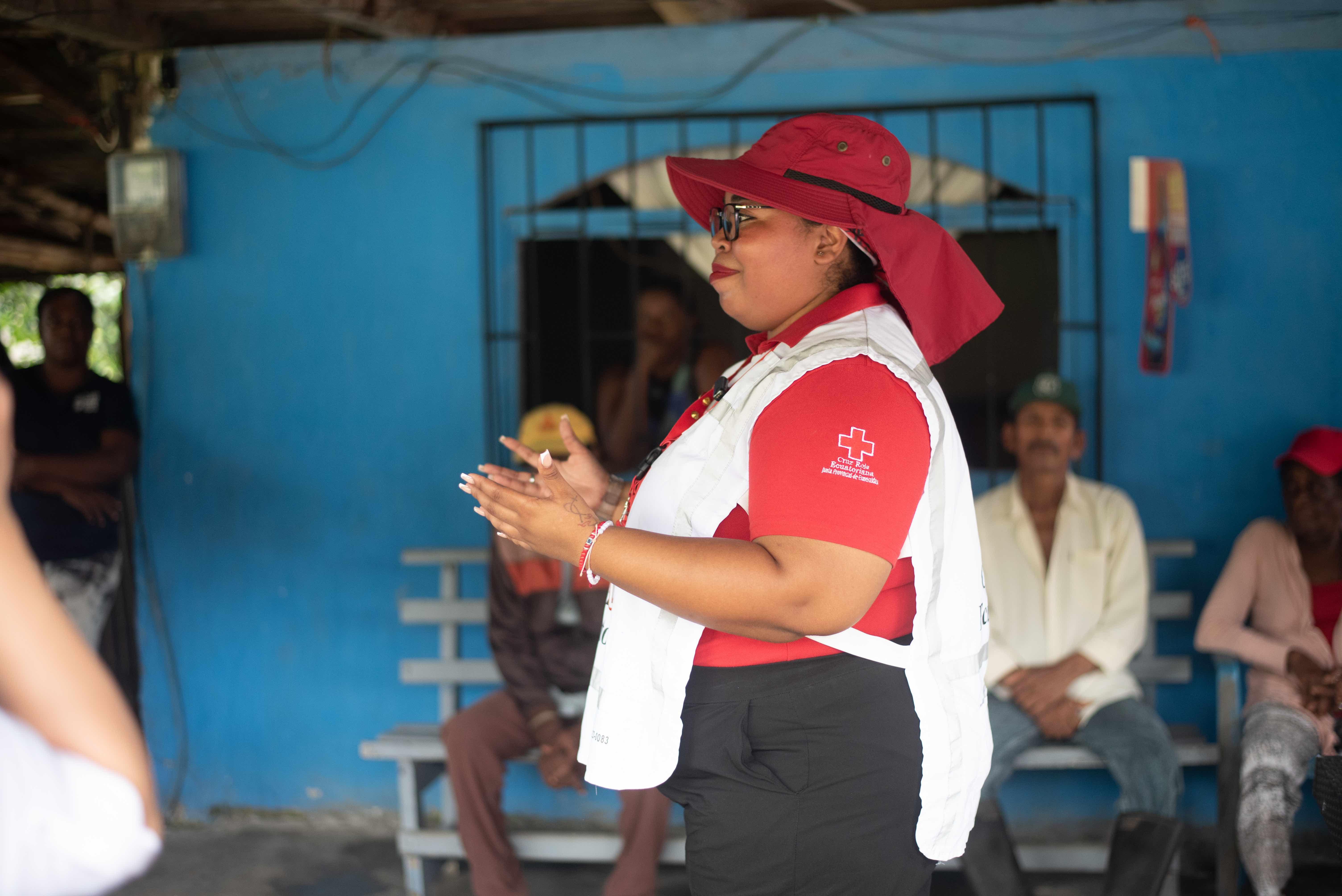 An Ecuadorian Red Cross volunteer from Esmereldas, Evelyn leads an informative session for the community: sessions include psychosocial support, kit distribution, water safety and more.