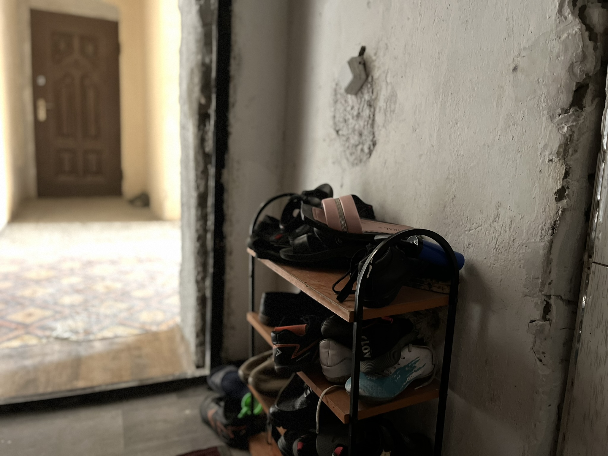 The shoe rack at the entrance to a home in Tajikistan where local authorities provide subsidized accommodations for refugees from Afghanistan, who also pay rent for their apartments. The Tajikistan Red Crescent Society has supported the refugees with food parcels and cash transfers, among other things.