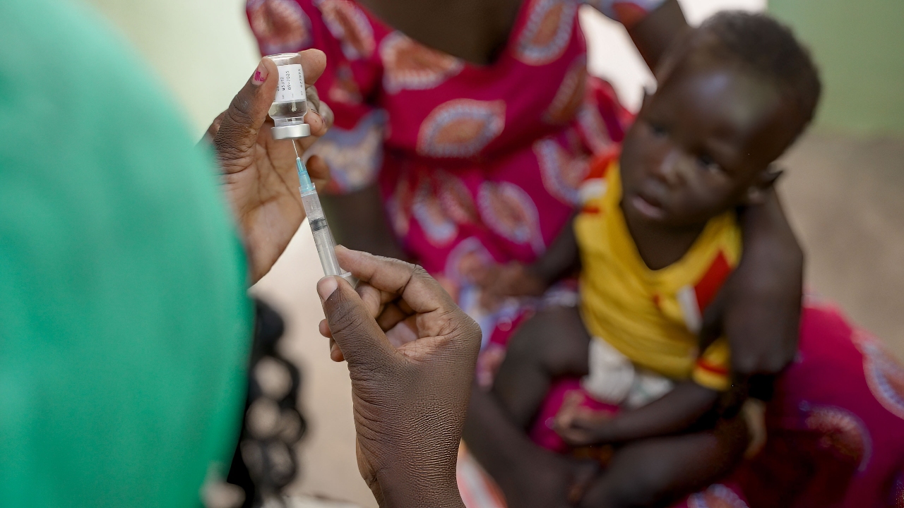 Maya Sylyie, a mother from Maya-Oulo village, Cameroon, brings her baby boy to the health centre to be vaccinated against measles.