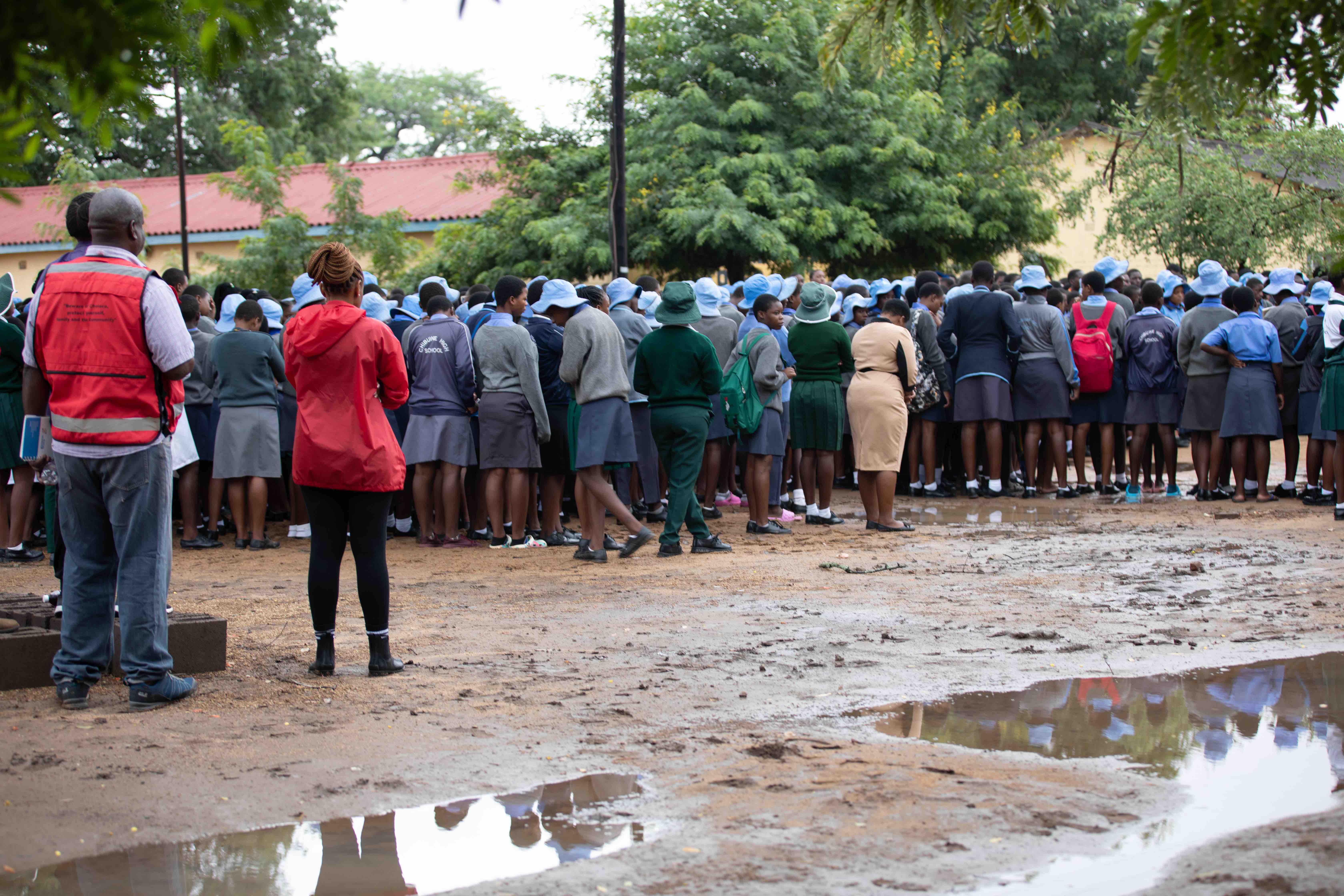 Students from a school in Chibuwe village in Zimbabwe’s Chipinge District prepare for an emergency flood preparedness simulation.