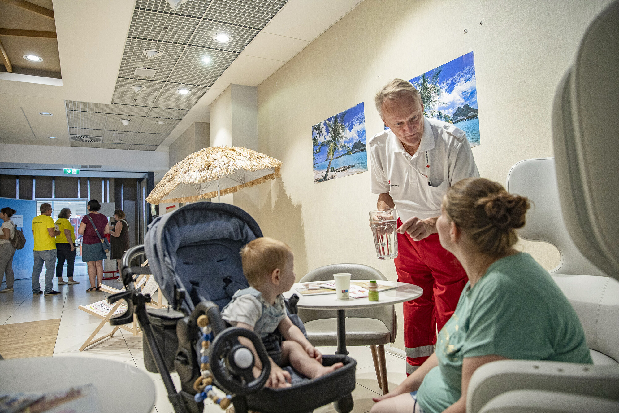 A mother and child enjoy one of the free cooling centres, set up by the Austrian Red Cross. The centres are air-conditioned rooms where people can recover from heat stress for a few hours.