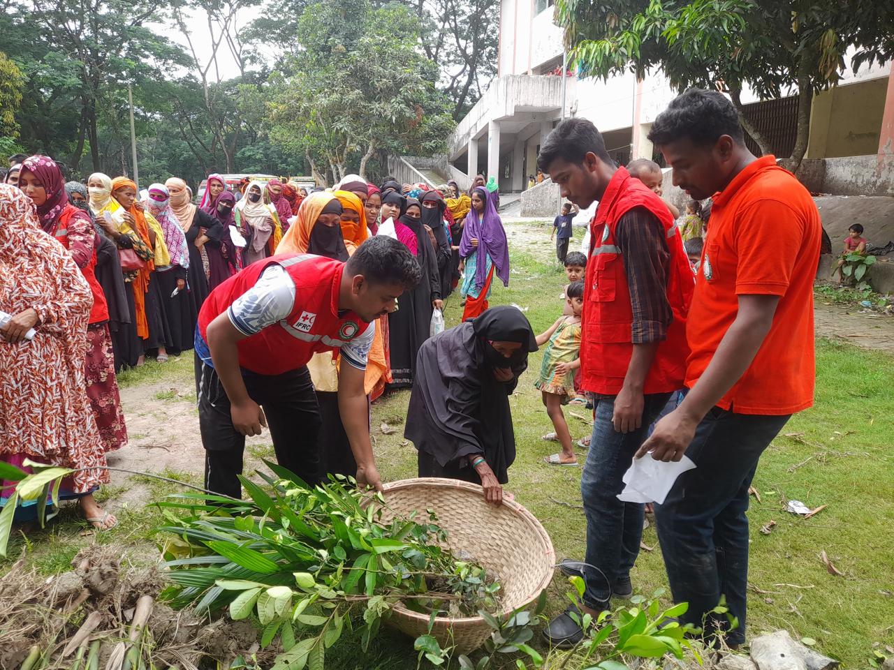 Bangladesh Red Crescent volunteers join community members in planting trees as part of an ecological approach to disaster risk reduction. More than 75,000 trees were planted across nine districts.