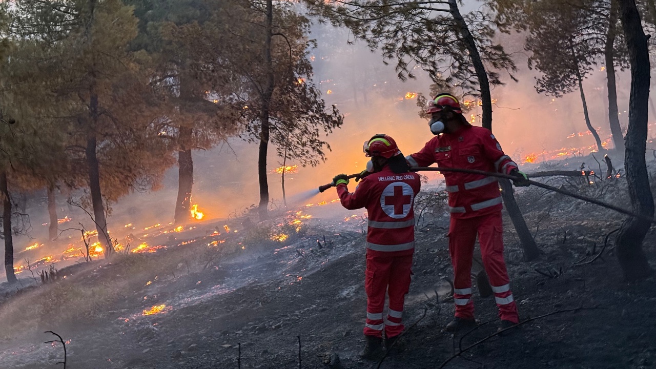 Volunteers from the Hellenic Red Cross volunteers work alongside firefighters as they battled wildfires outside of Athens. 