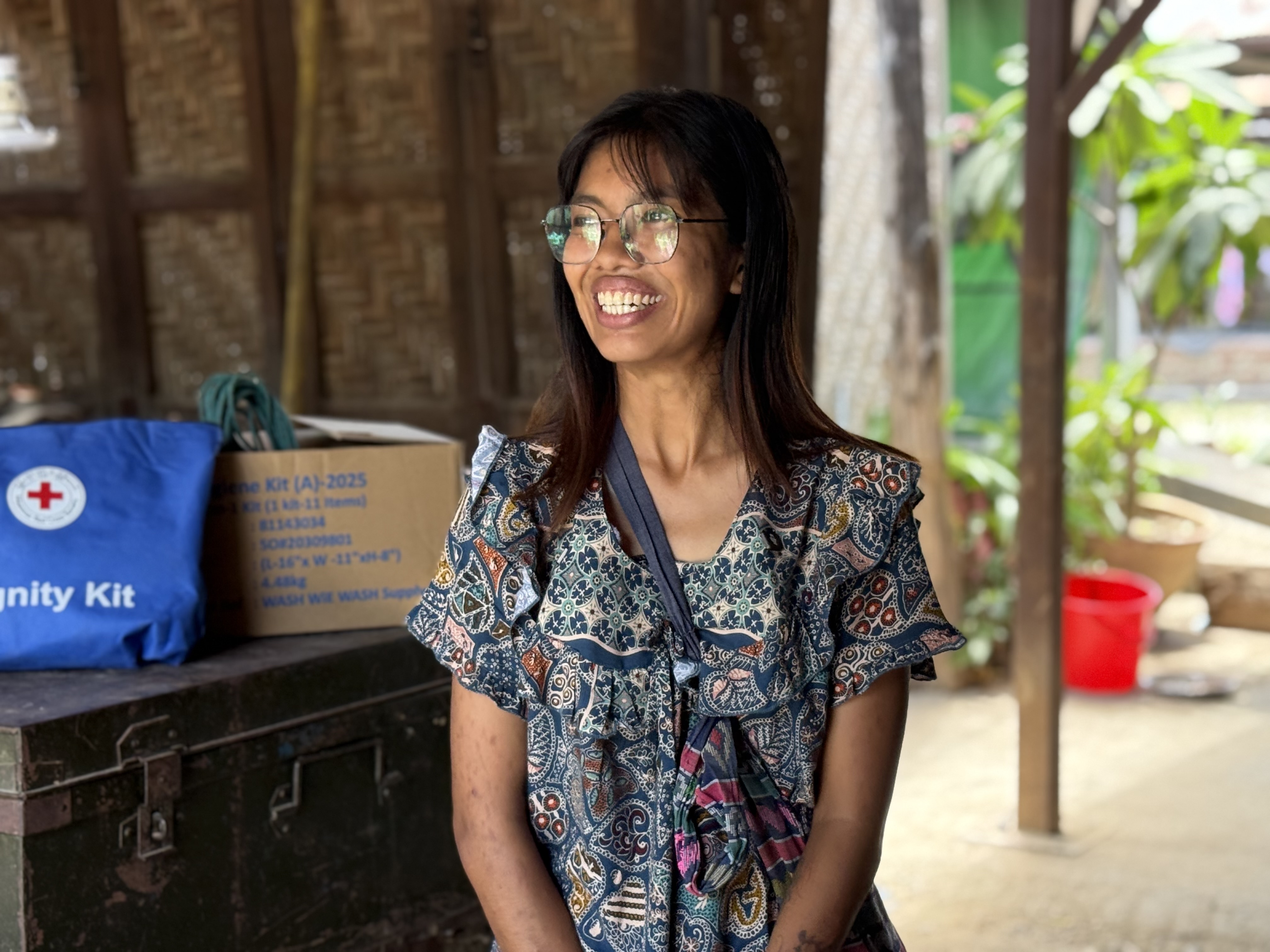 Earthquake survivor Yadanar Yu Hlaing Kyuu copes with the trauma of losing her home, her job and many loved ones by volunteering to help in the camp where she and 126 other families have been living since the quake struck in March 2025.